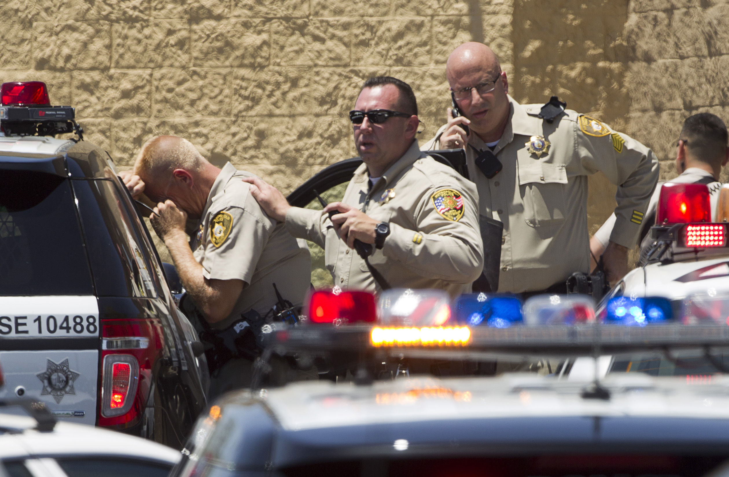 Metro Police officers are shown outside a Wal-Mart after a shooting in Las Vegas