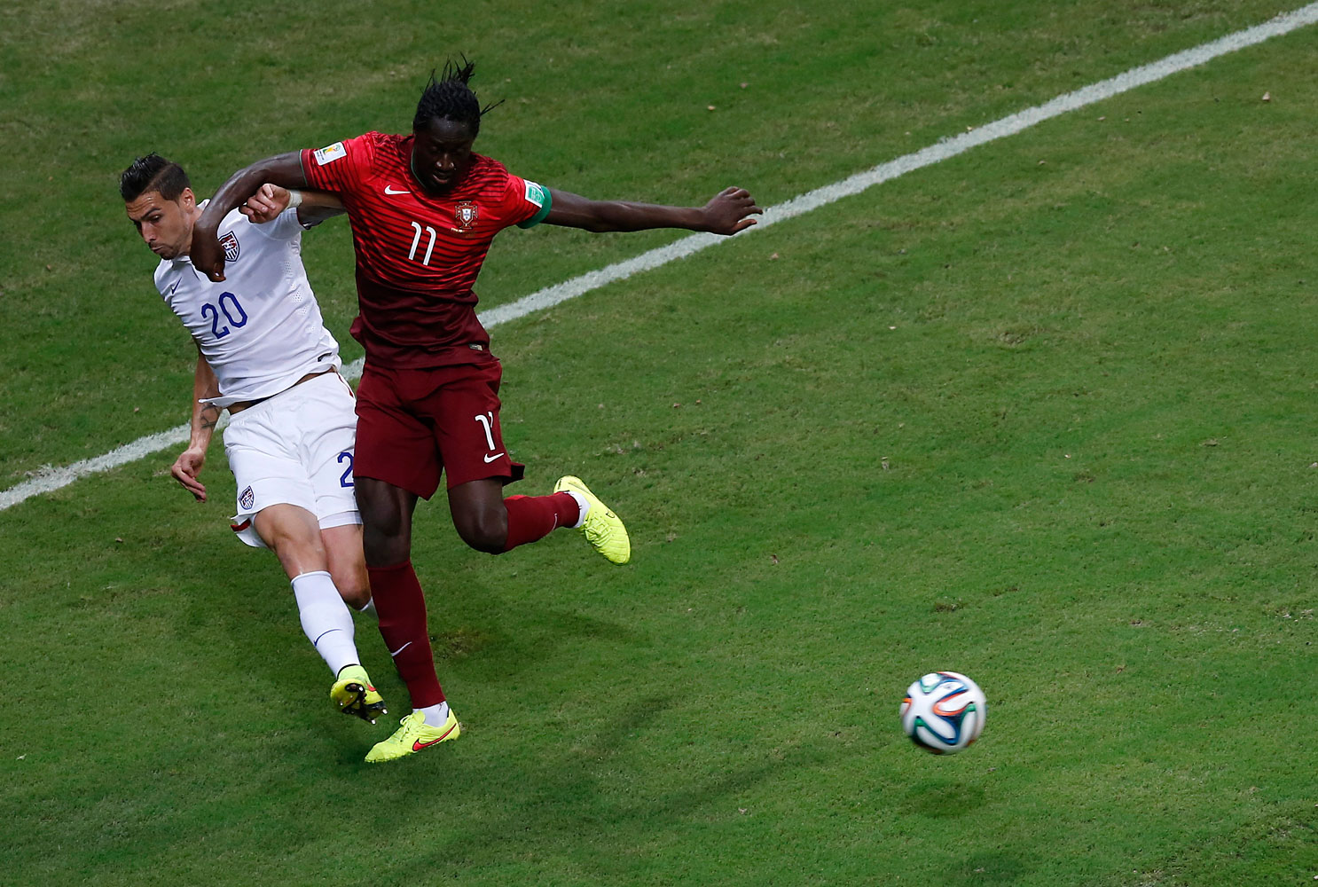 Geoff Cameron of the U.S. and Portugal's Eder fight for the ball.
