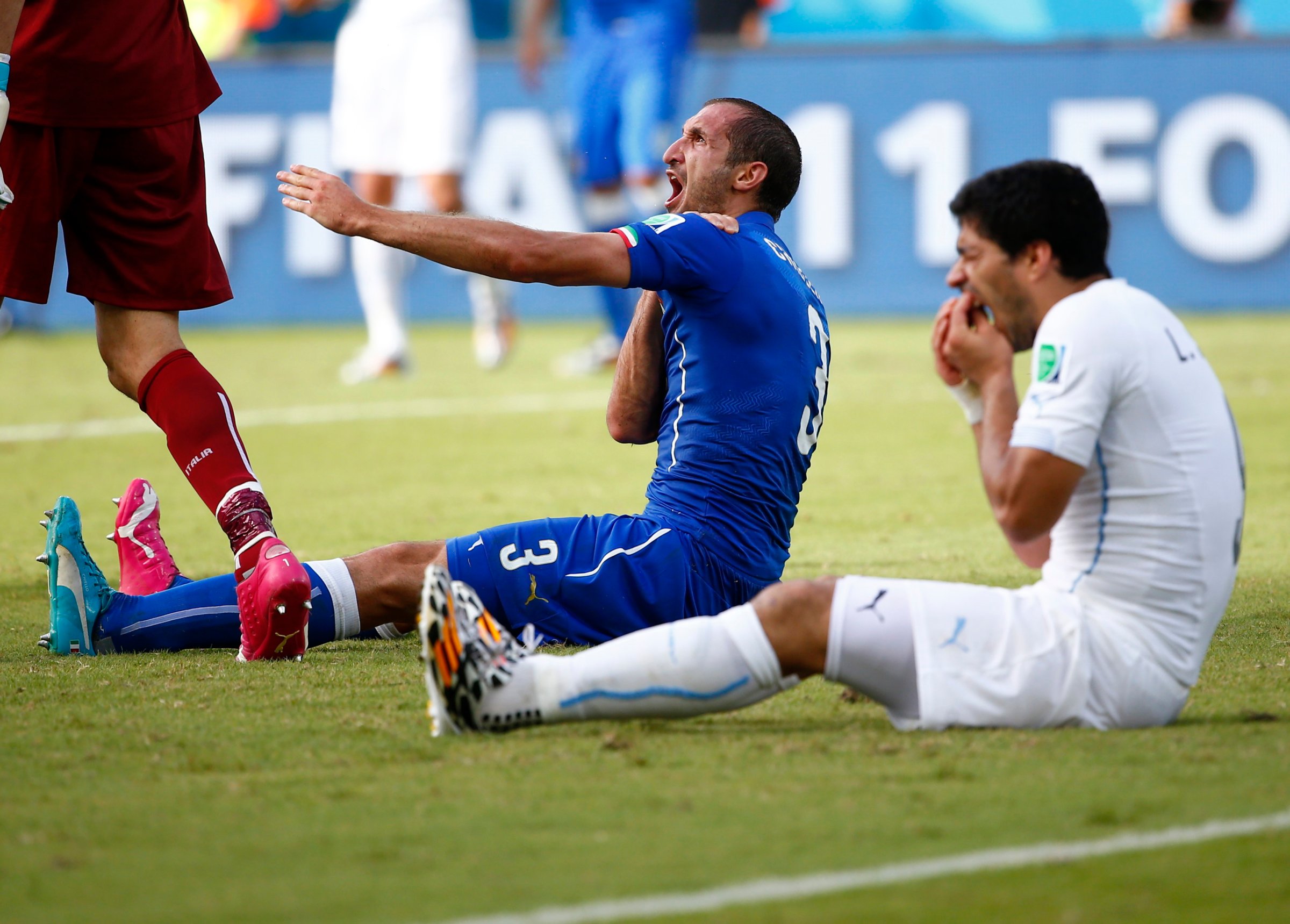 Uruguay's Luis Suarez reacts after clashing with Italy's Giorgio Chiellini during their 2014 World Cup Group D soccer match at the Dunas arena in Natal