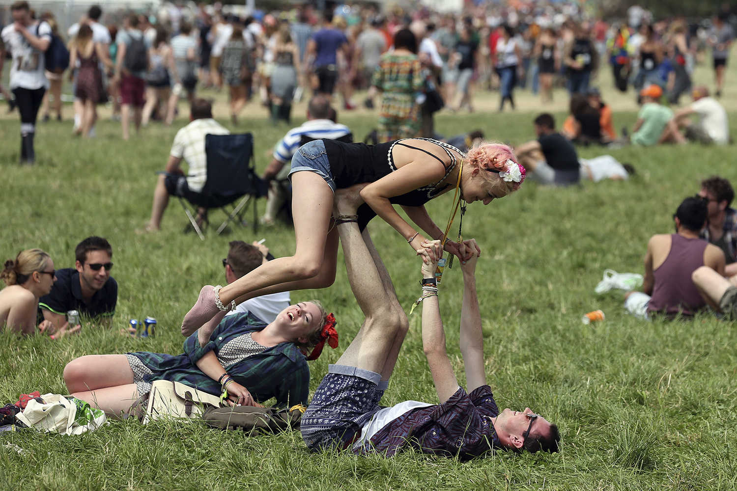 June 26, 2014. Festival goers are pictured in front of the Pyramid Stage at Worthy Farm in Somerset, England, on the second day of the Glastonbury music festival.