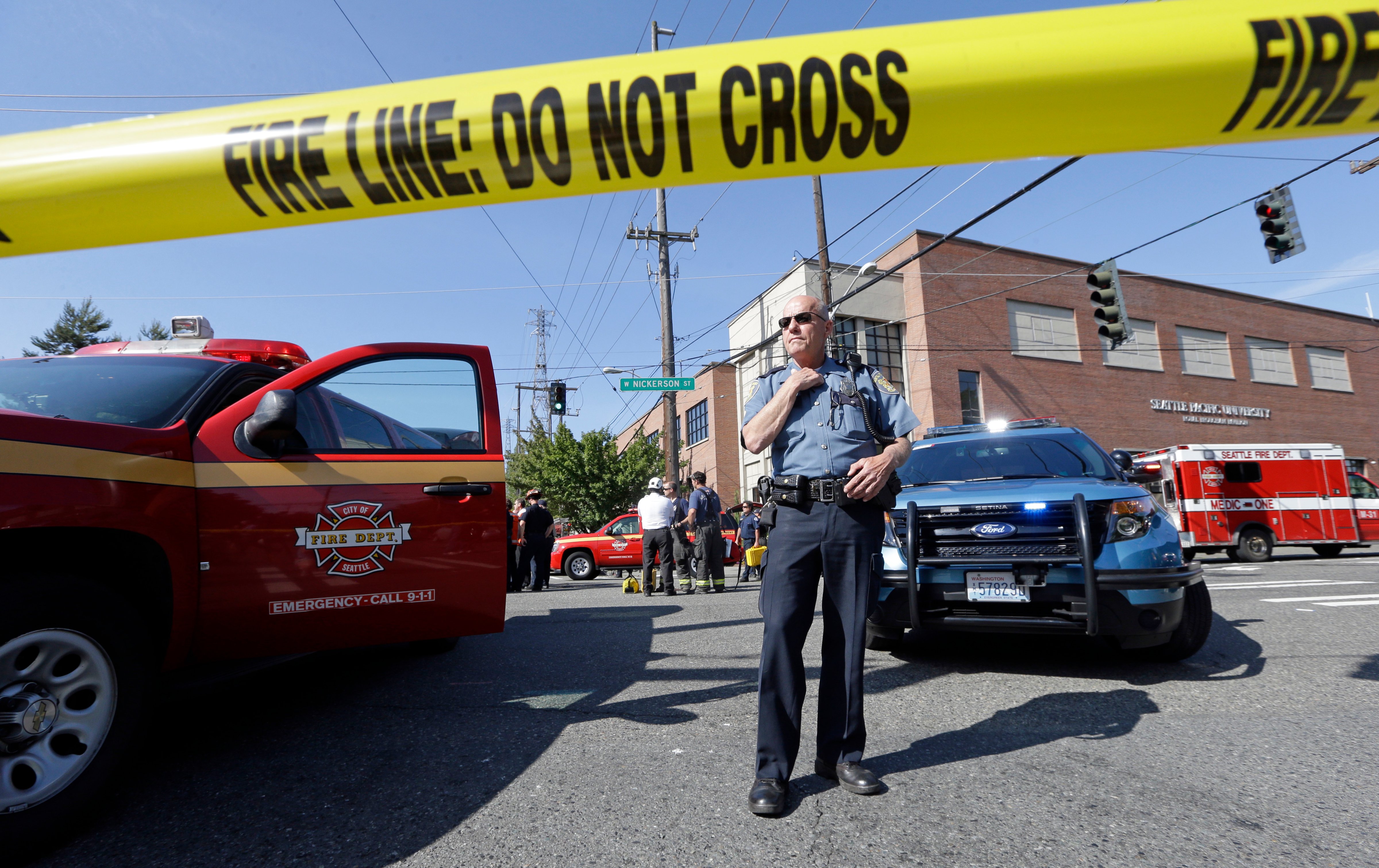 A police officer stands near the scene of a shooting on the campus of Seattle Pacific University in Seattle, June 5, 2014. (Elaine Thompson—AP)