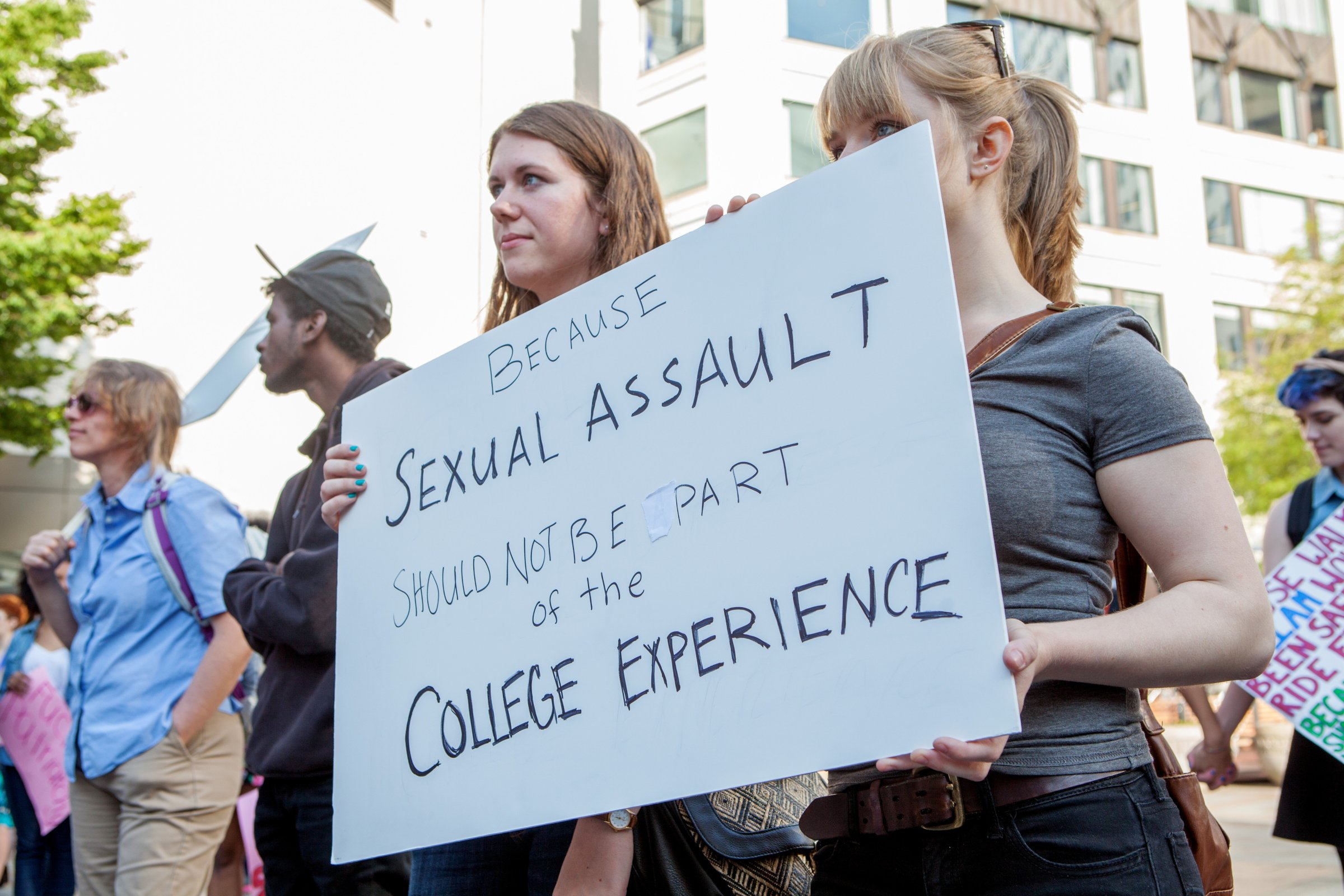 Demonstrators protest sexual assault on college campuses at the #YesAllWomen rally in solidarity with those affected by violence in Seattle on May 30, 2014.