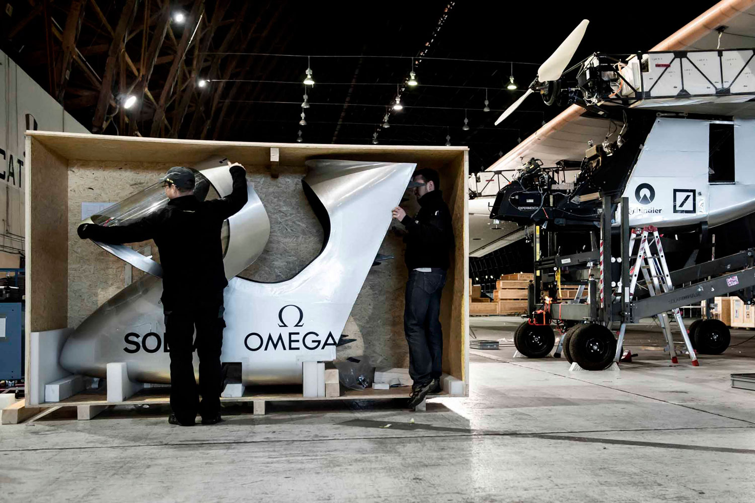 Solar Impulse's HB-SIA prototype is being reassembled after arriving from Switzerland on board a Boeing 747 cargo plane.