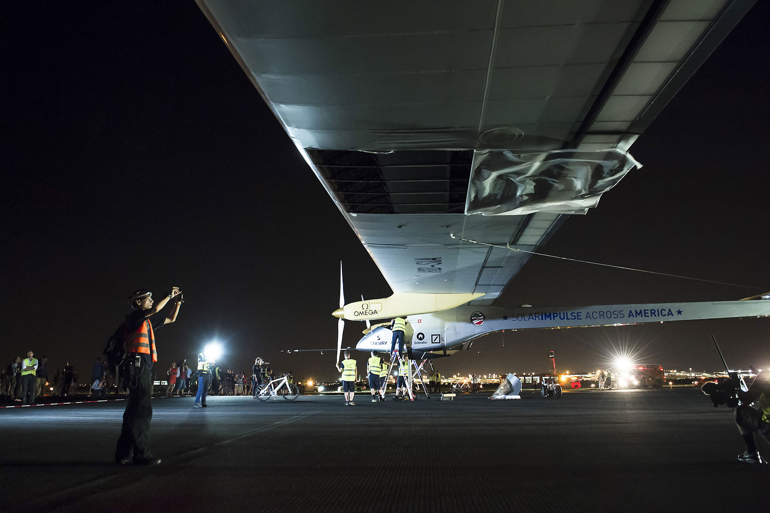 A tear in the wing fabric of the Solar Impulse airplane following landing at John F. Kennedy International Airport in New York, July 6, 2013.
