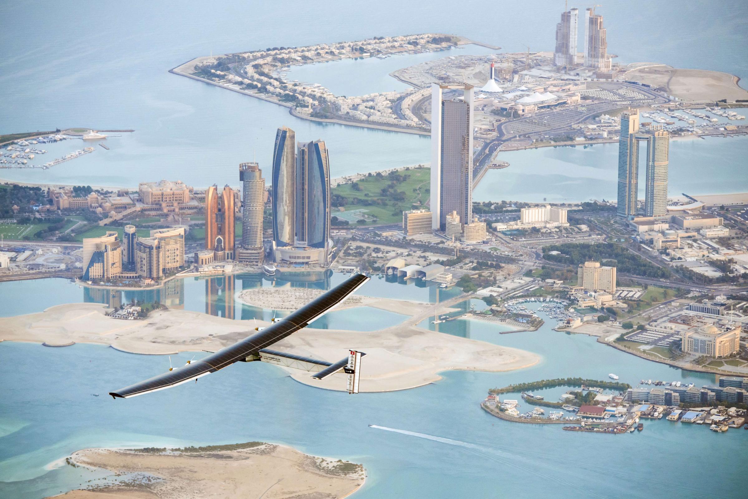 Solar Impulse 2 flies over the Emirati capital Abu Dhabi on Feb. 26, 2015 ahead of a planned round-the-world tour to promote alternative energy.
