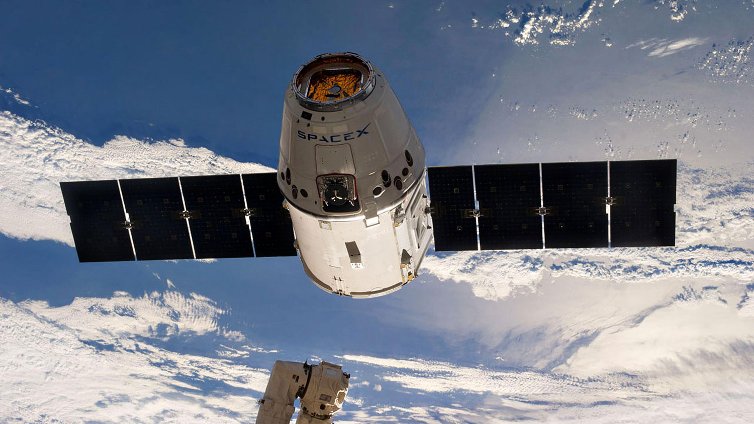 SpaceX's Dragon unmanned space capsule disconnects from the International Space Station to return to Earth on May 19, 2014.