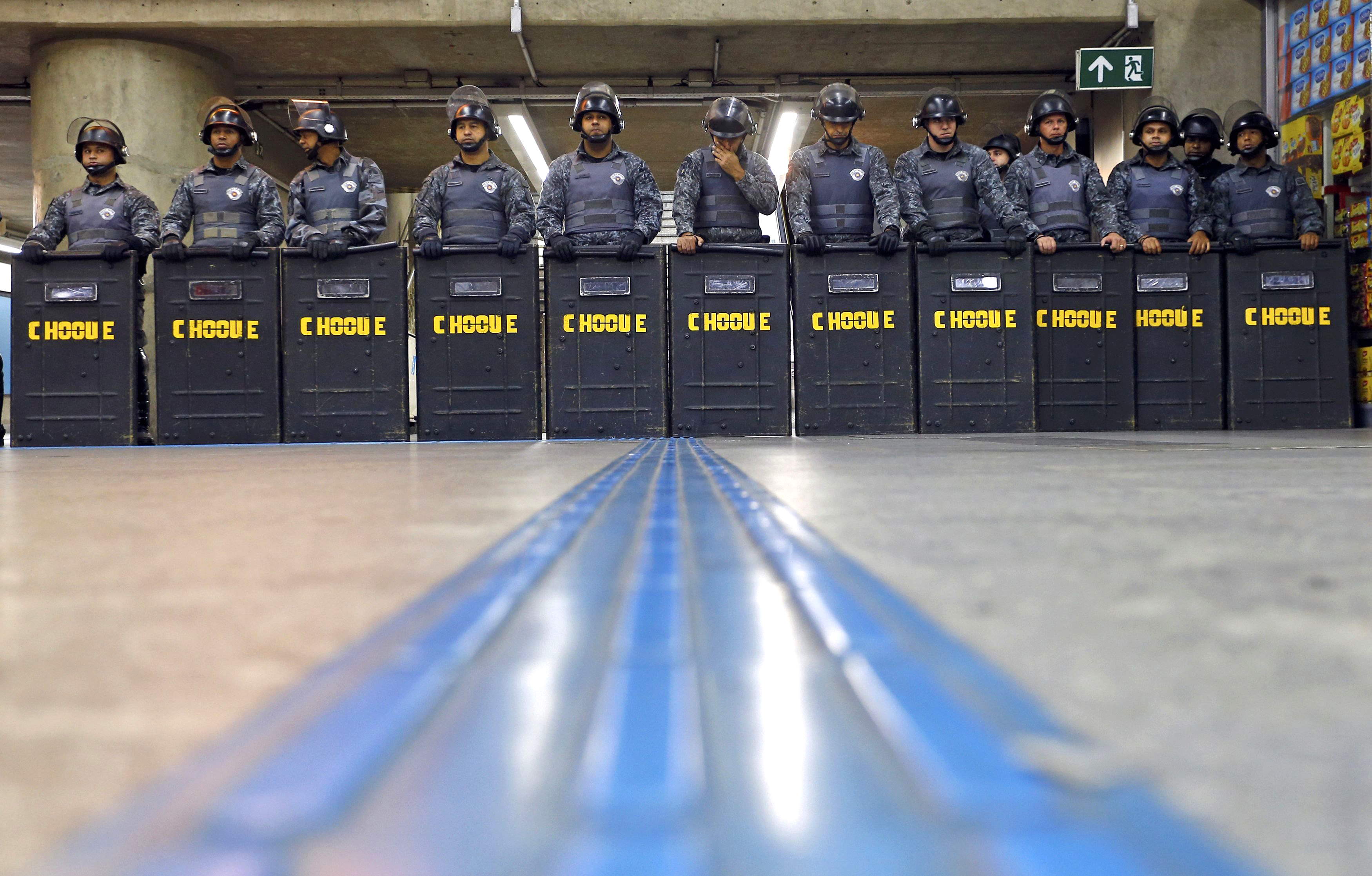 Policemen in riot gear stand inside Ana Rosa subway station during the fifth day of metro worker's protest in Sao Paulo on June 9, 2014. (Kai Pfaffenbach—Reuters)
