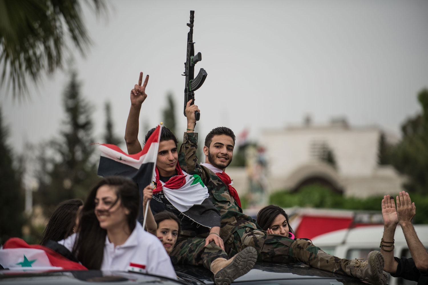 Syrian supporters of presidential candidate Bashar al-Assad attend a march in Damascus on June 3, 2014.