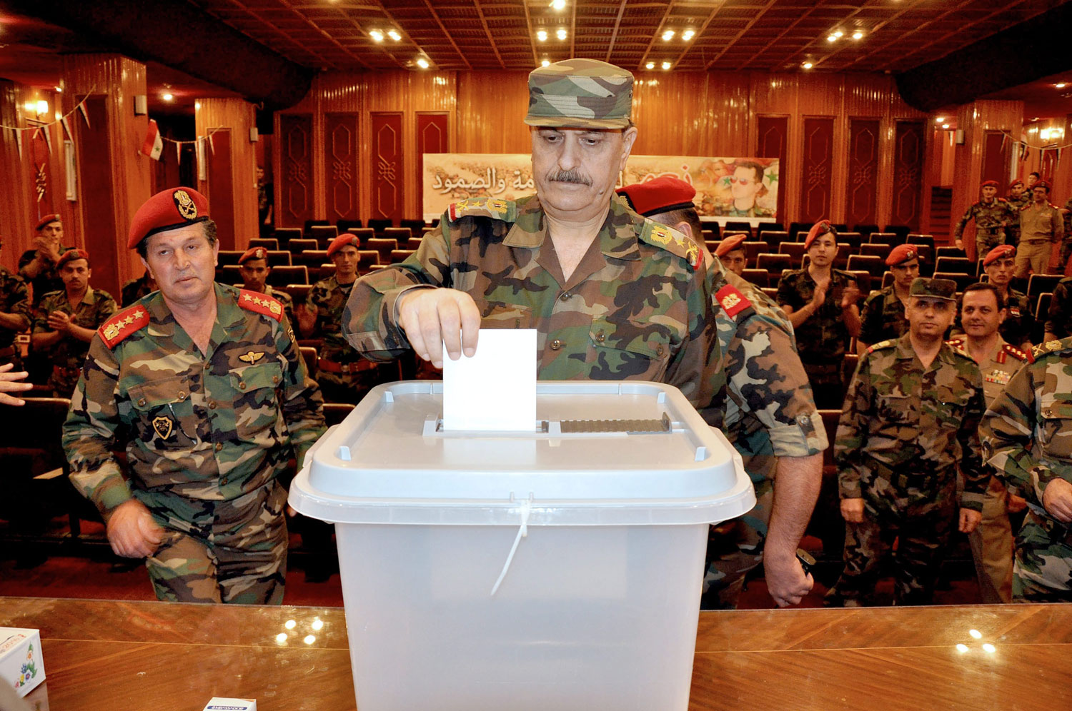 Syrian Defence Minister Fahd Jassem al-Freij casting his ballot at a polling station in Damascus on June 3, 2014.