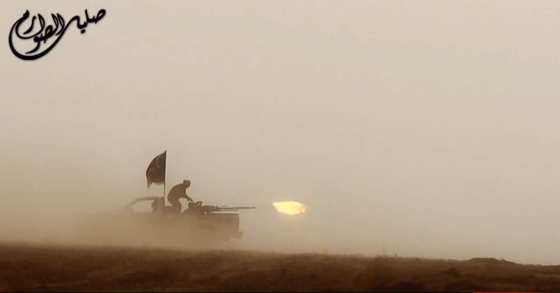 An image grab taken from a propaganda video uploaded on June 8, 2014, by the jihadist group the Islamic State of Iraq and the Levant (ISIL) allegedly shows ISIL militants firing from the back of a vehicle near the central Iraqi city of Tikrit. (AFP/Getty Images)