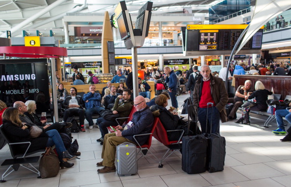 Passengers wait at London Heathrow International Airport