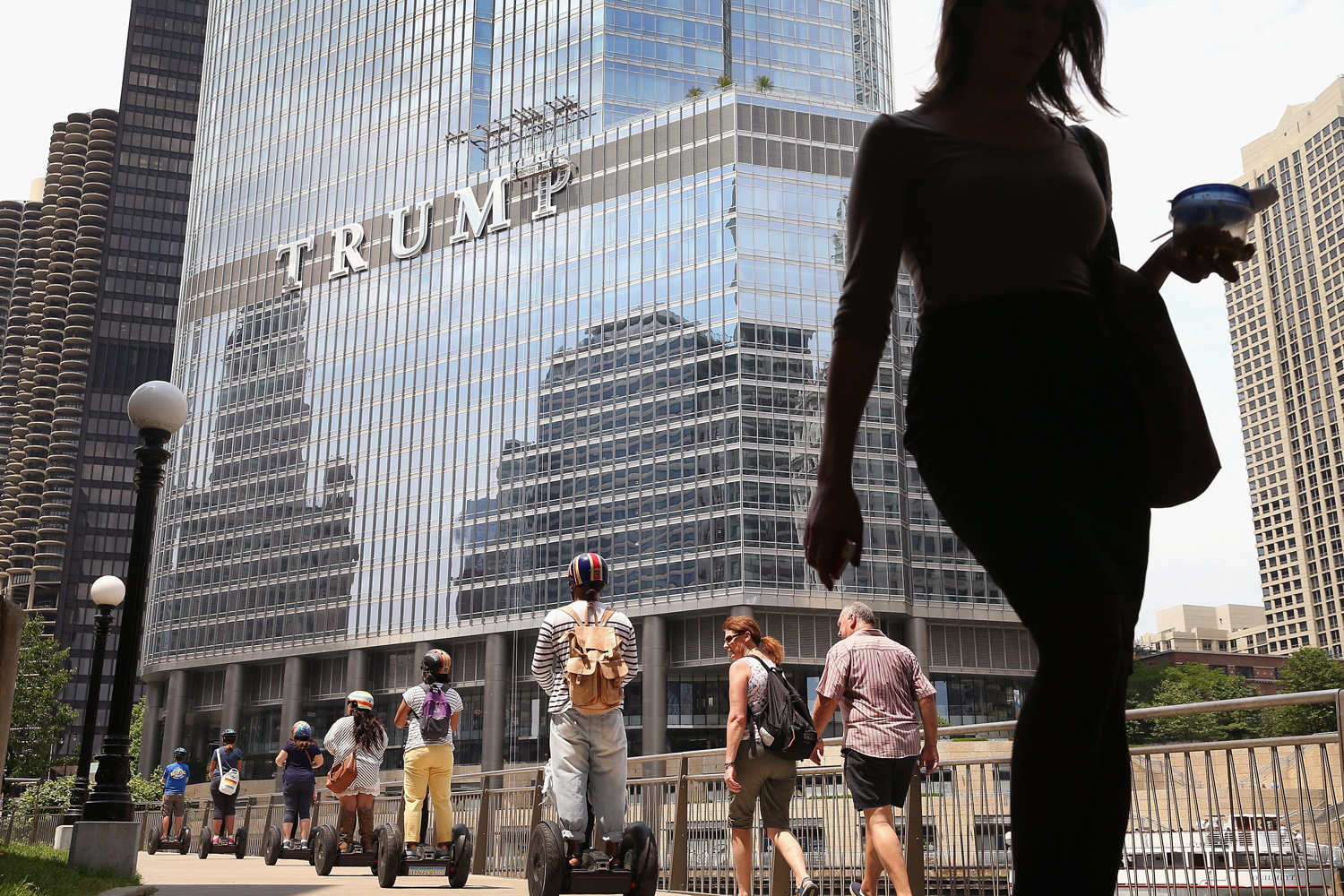 Workers install the final letter for a giant TRUMP sign on the outside of the Trump Tower on June 12, 2014 in Chicago, Ill. (Scott Olson—Getty Images)