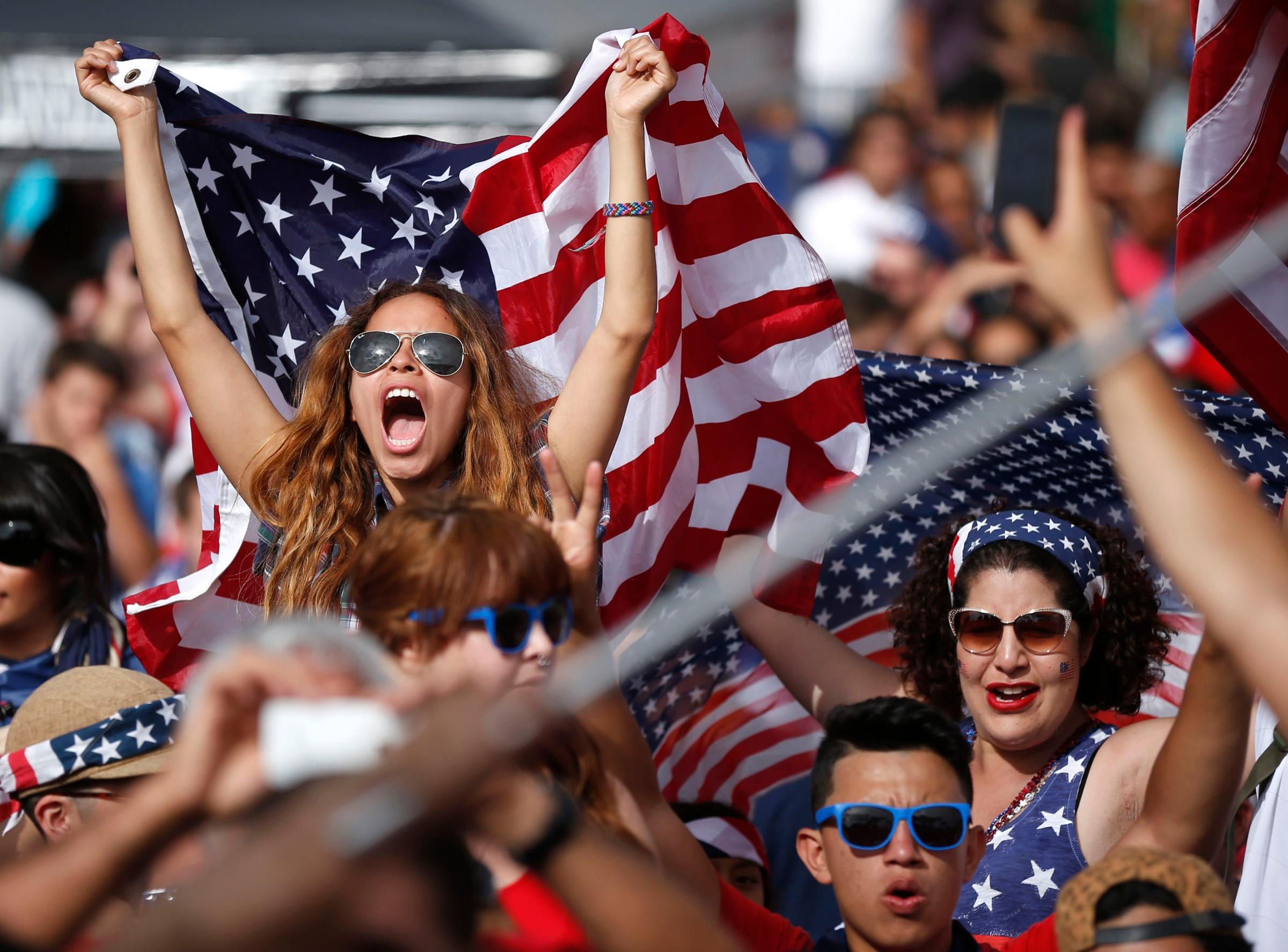 Fans cheer during the 2014 World Cup Group G soccer match between Ghana and the U.S. at a viewing party in Hermosa Beach