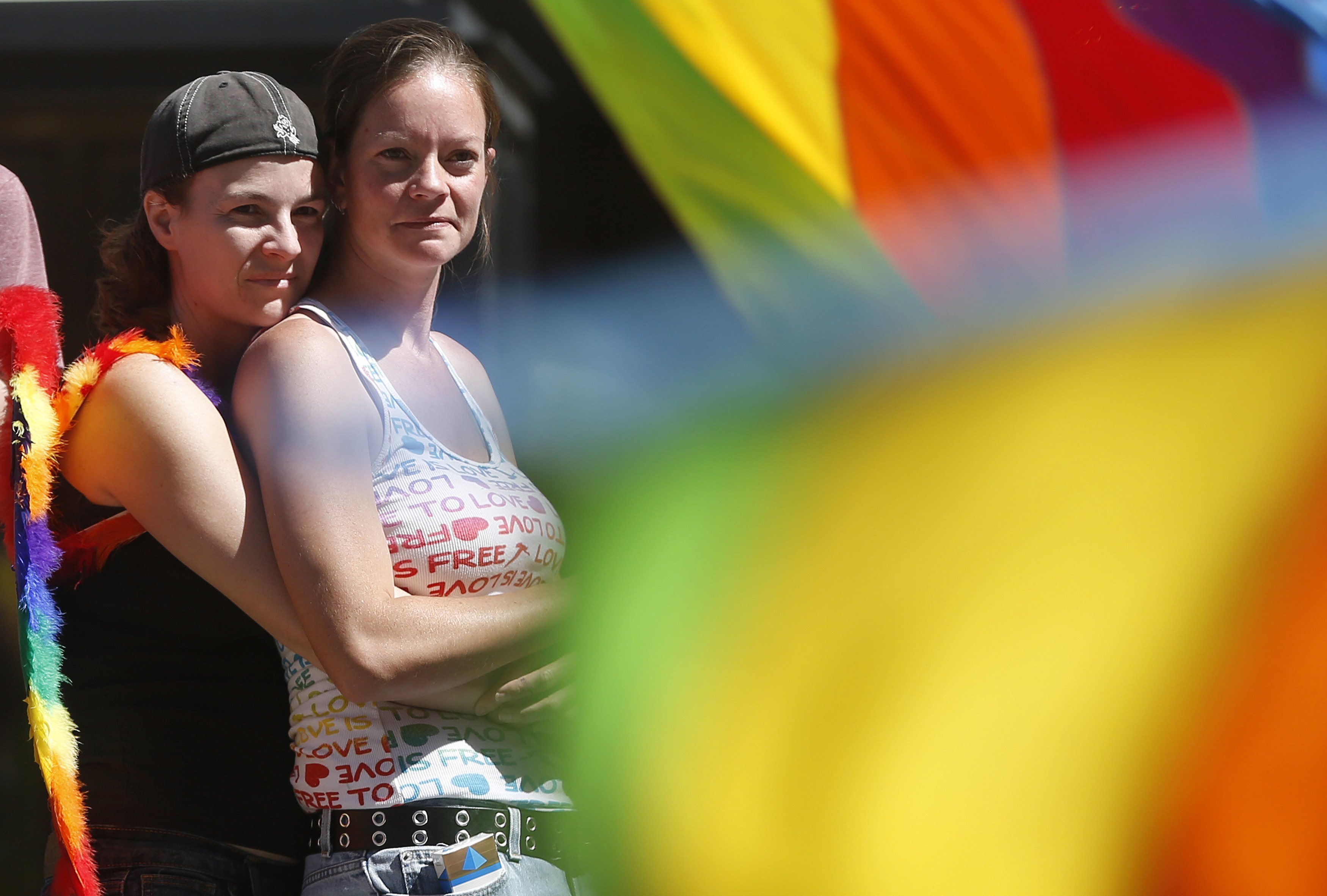 Lynn Herre (L) and her partner Jana Mark watch the Utah Pride Parade in Salt Lake City, Utah, June 8, 2014. (Jim Urquhart—Reuters)