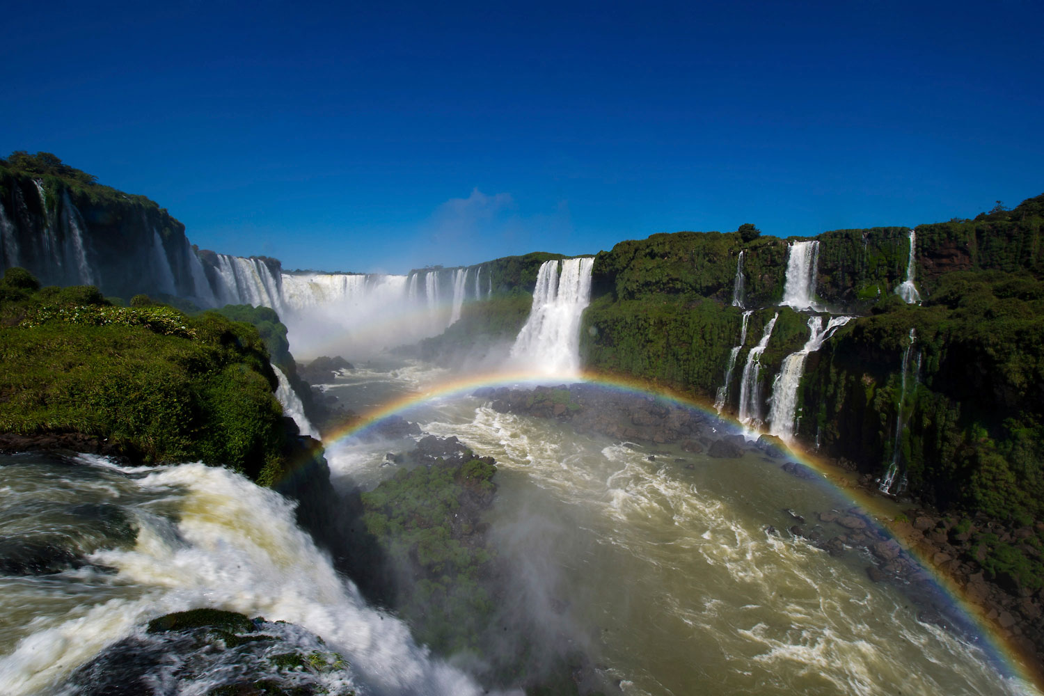 The Iguazu Falls, surrounded by lush forest and exotic wildlife, are a set of nearly 300 waterfalls in the Iguazu River located on the Brazil-Argentina border.