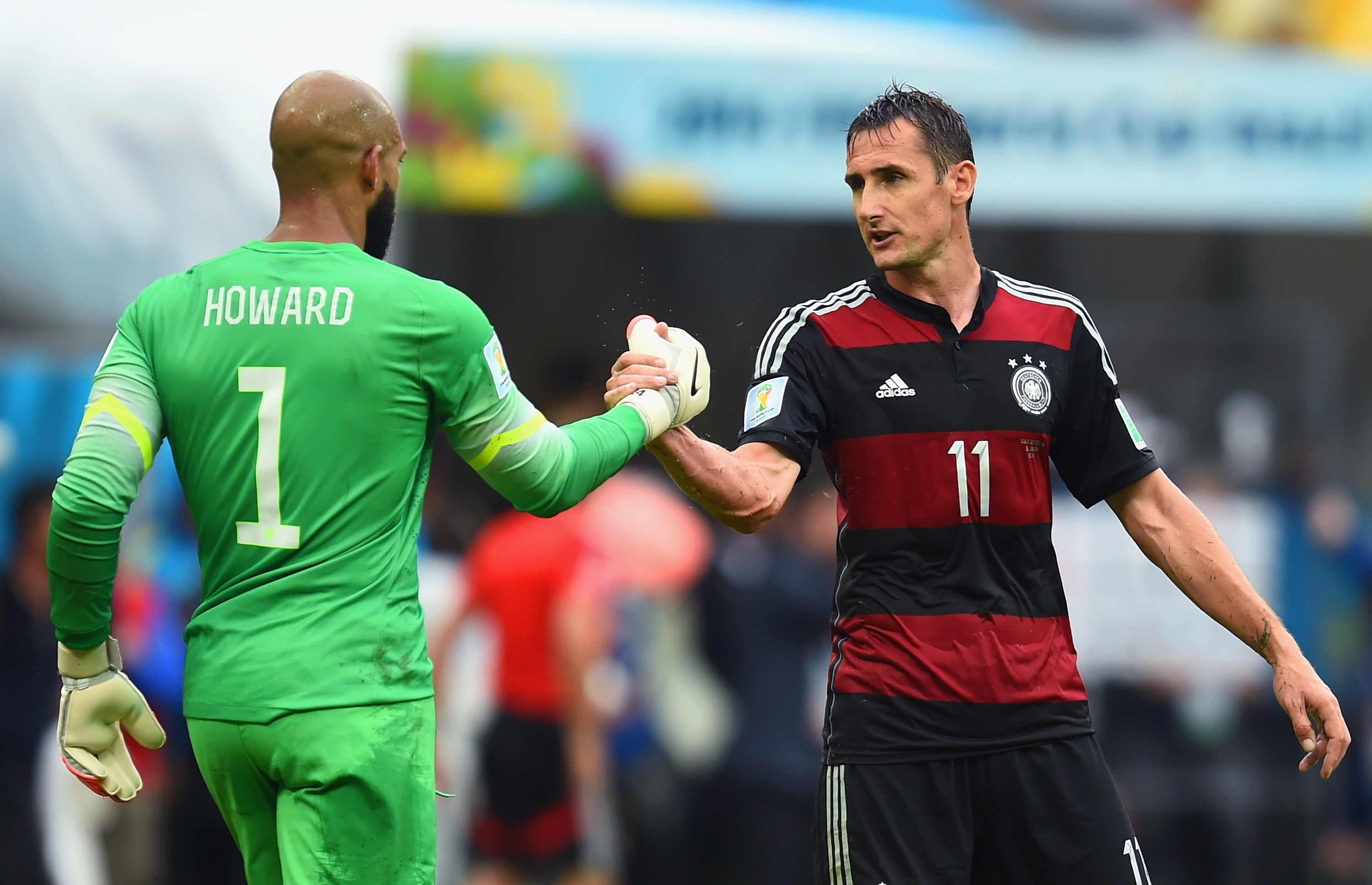 Tim Howard of the United States and Miroslav Klose of Germany shake hands after Germany's 1-0 win during the 2014 FIFA World Cup Brazil group G match between the United States and Germany at Arena Pernambuco on June 26, 2014 in Recife, Brazil. (Jamie McDonald&mdash;Getty Images)