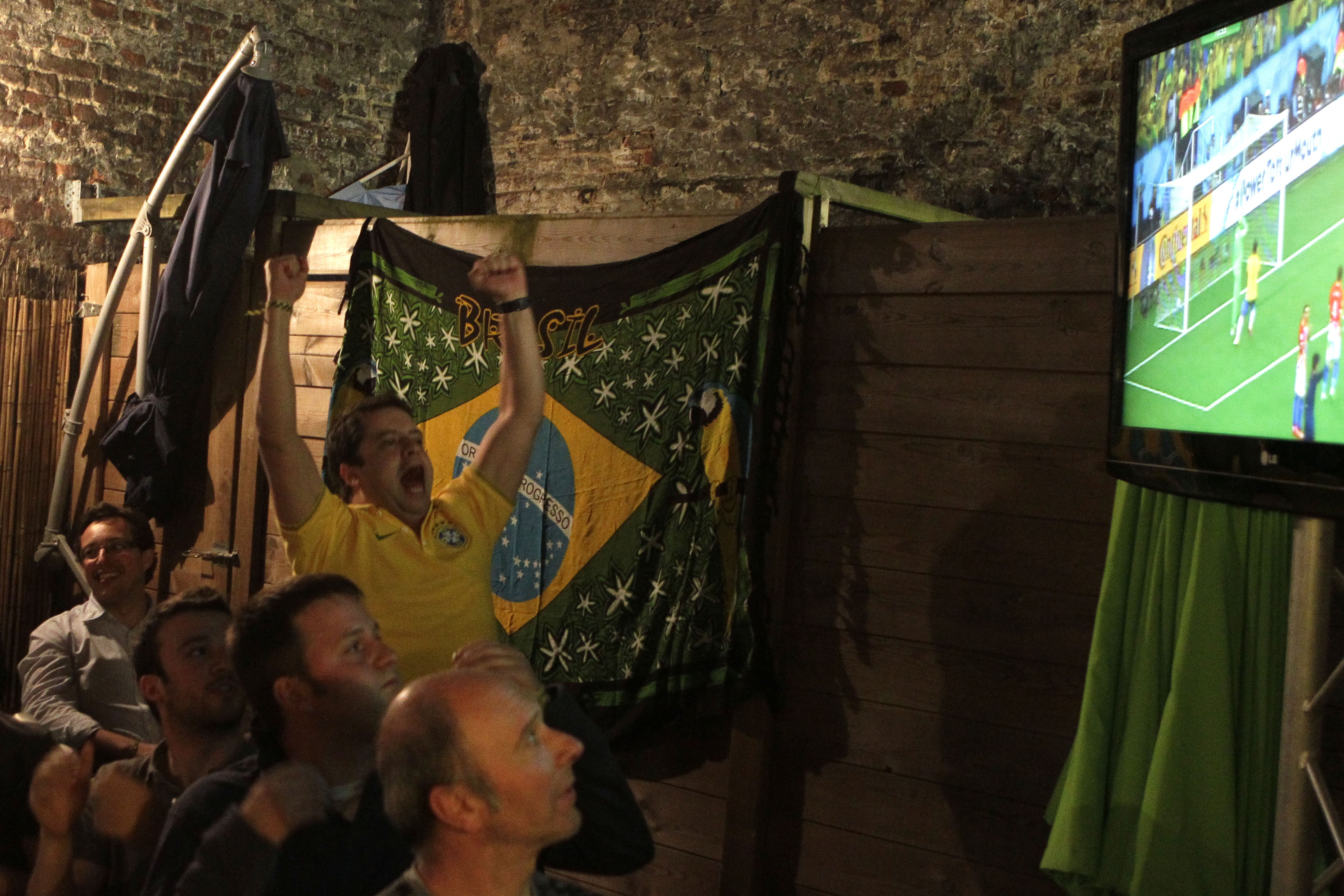 Brazil soccer fan reacts after the second goal for Brazil during the first 2014 World Cup soccer match between Brazil and Croatia, in a restaurant in Lille, northern France on  June 12, 2014