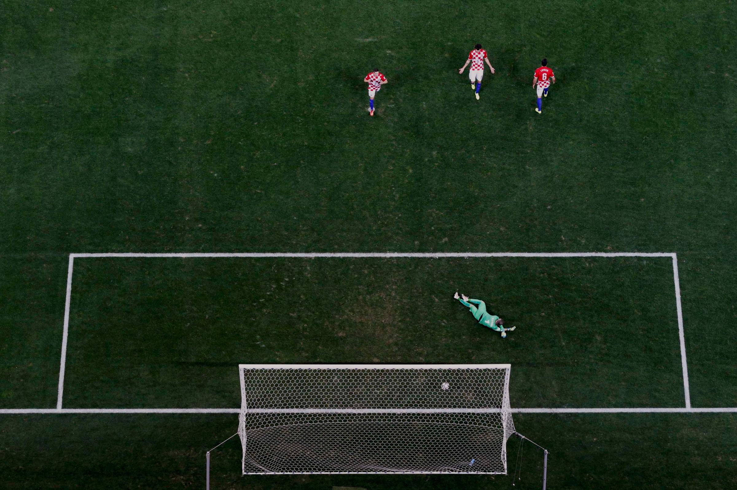 Croatia's players react after conceding a goal to Brazil's Oscar during their 2014 World Cup opening match at the Corinthians arena in Sao Paulo