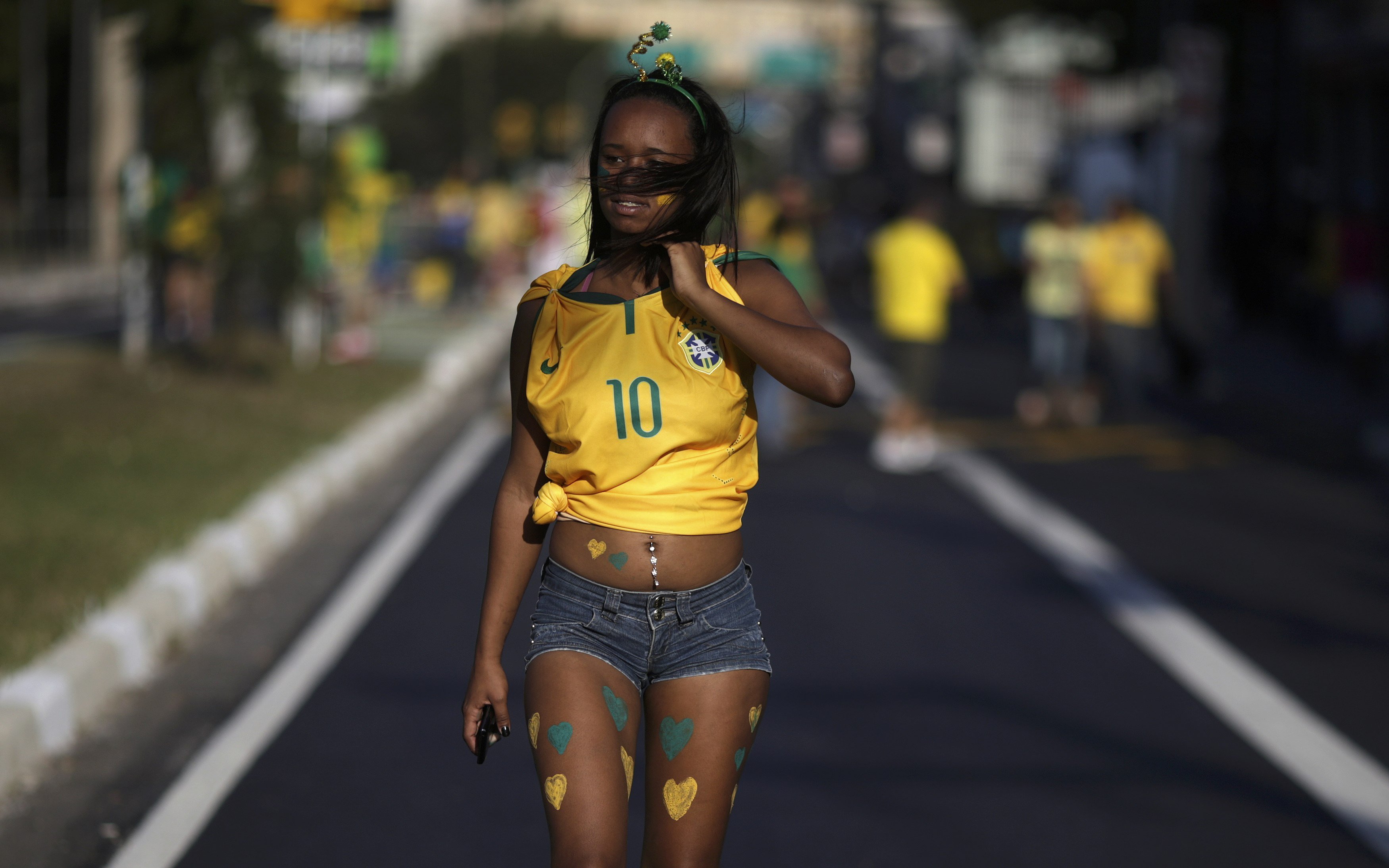 A brazilian soccer fan walks on the street near the Corinthians Arena ahead the 2014 World Cup match between Brazil and Croatia in Sao Paulo on June 12, 2014.