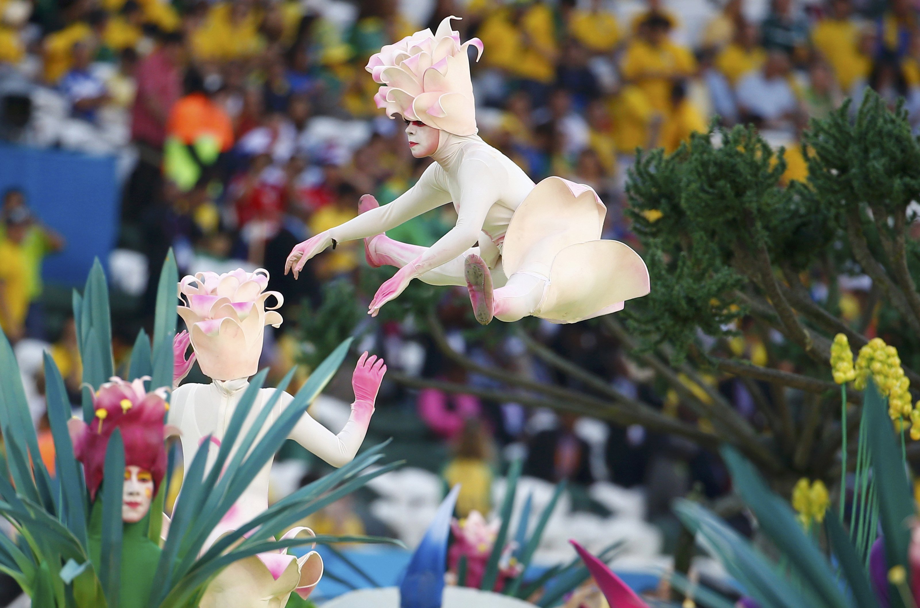 Performers participate in the opening ceremony of the 2014 World Cup at the Corinthians arena in Sao Paulo on June 12, 2014.