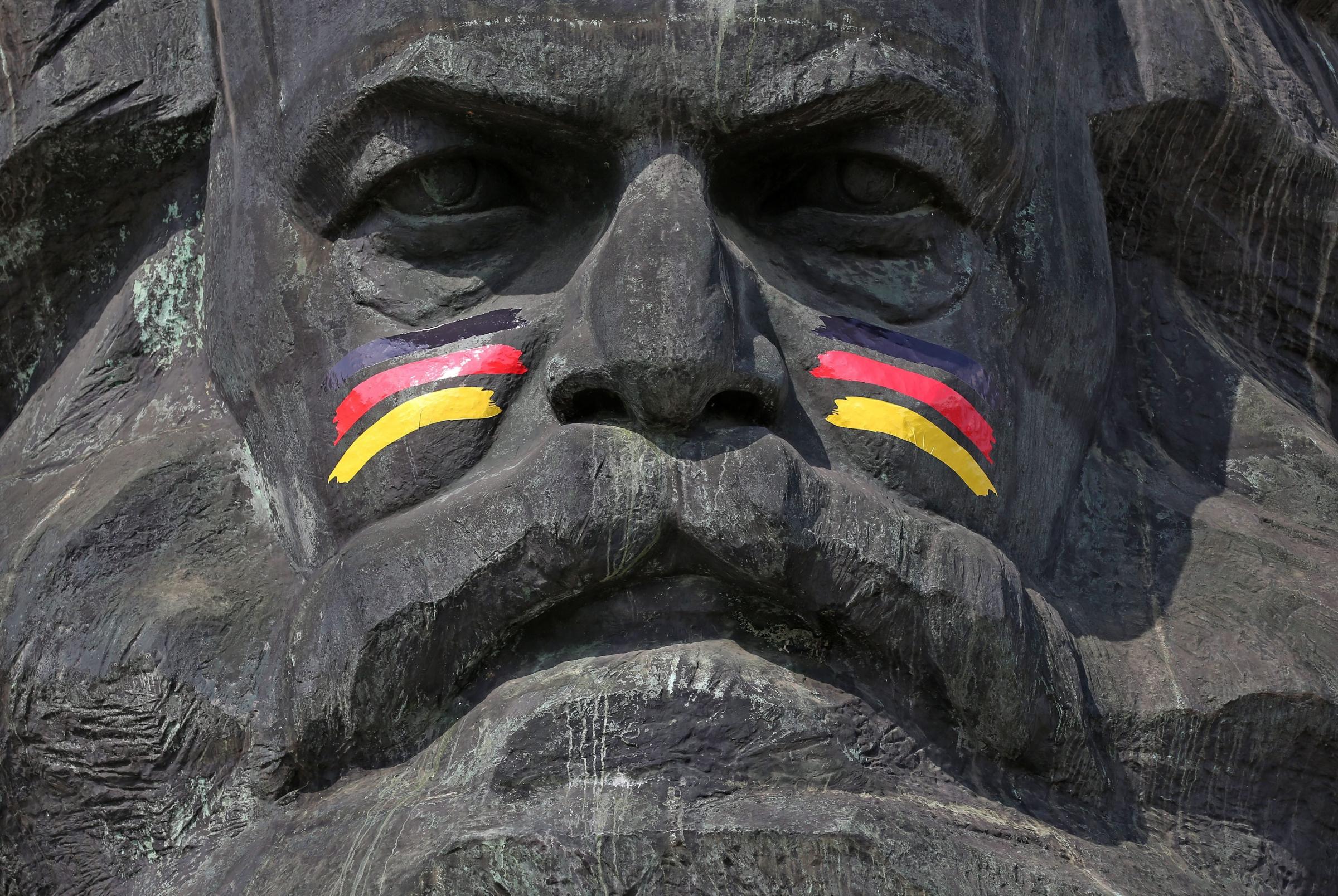 The Karl Marx monument has been decorated with German flags painted on his cheeks in Chemnitz, Germany on June 16, 2014.