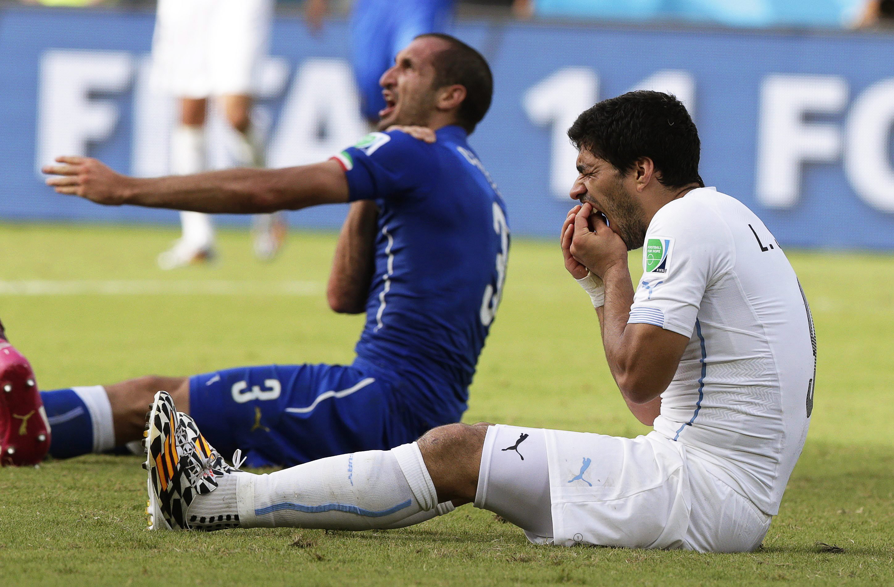 Giorgio Chiellini claims he was bitten by Uruguay's Luis Suarez during the FIFA World Cup 2014 group D preliminary round match between Italy and Uruguay at the Estadio Arena das Dunas in Natal, Brazil on June 24, 2014.