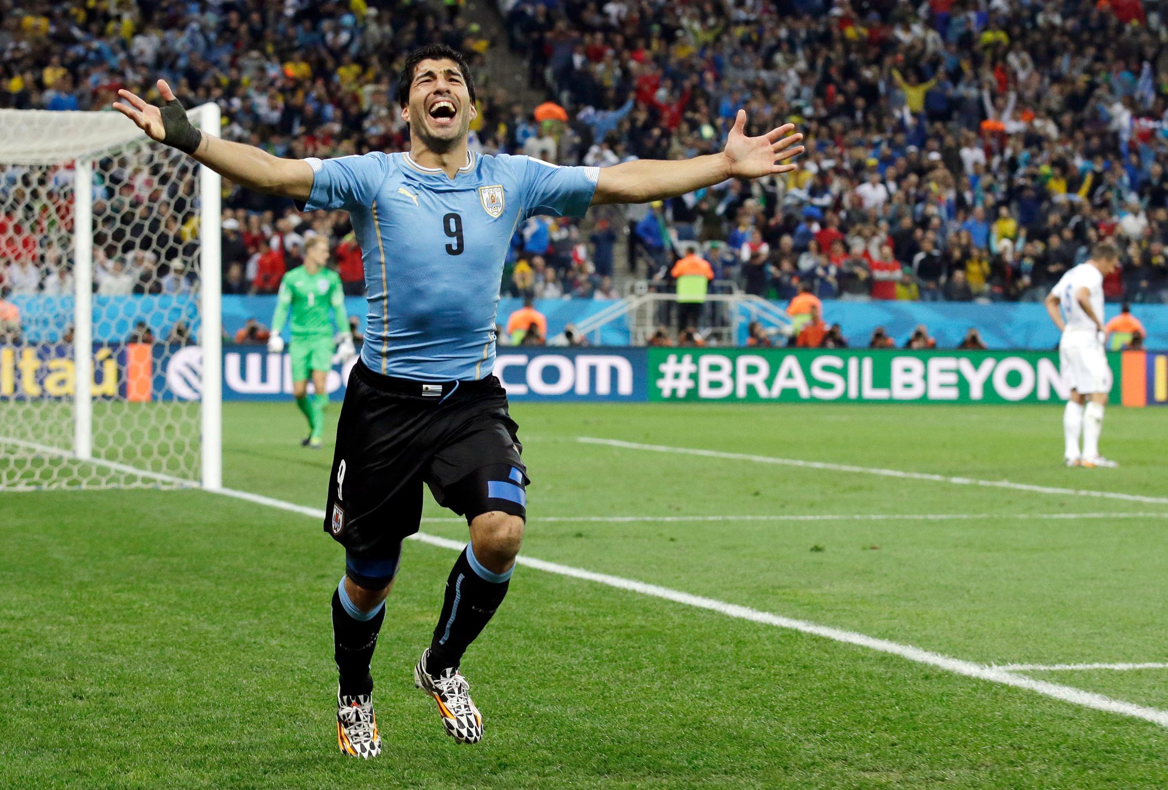 Uruguay's Luis Suarez celebrates after scoring his side's second goal during the group D World Cup soccer match between Uruguay and England at the Itaquerao Stadium in Sao Paulo, Brazil on June 19, 2014.