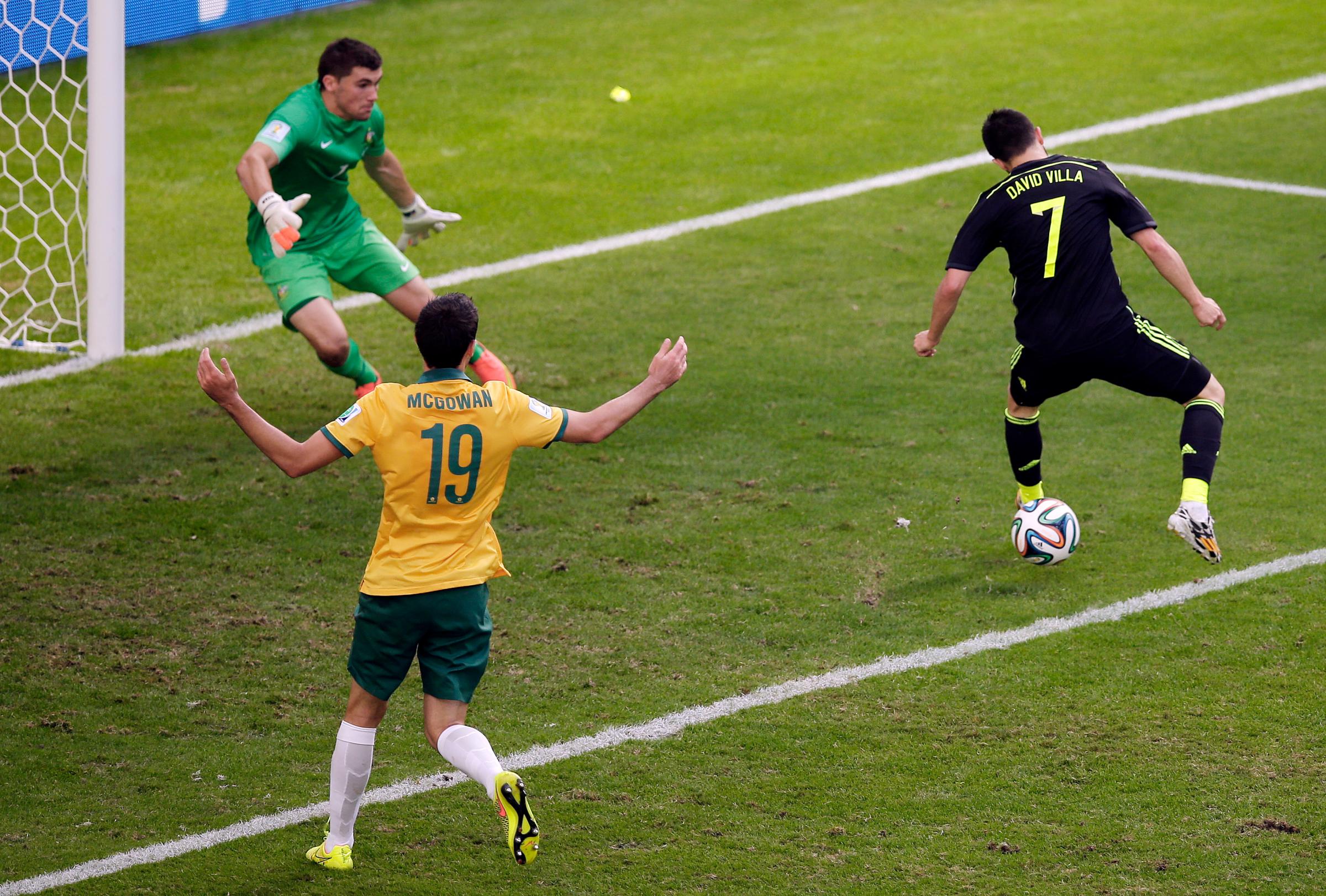 Spain's David Villa scores the team's first goal during the group B World Cup soccer match between Australia and Spain at the Arena da Baixada in Curitiba, Brazil on June 23, 2014.