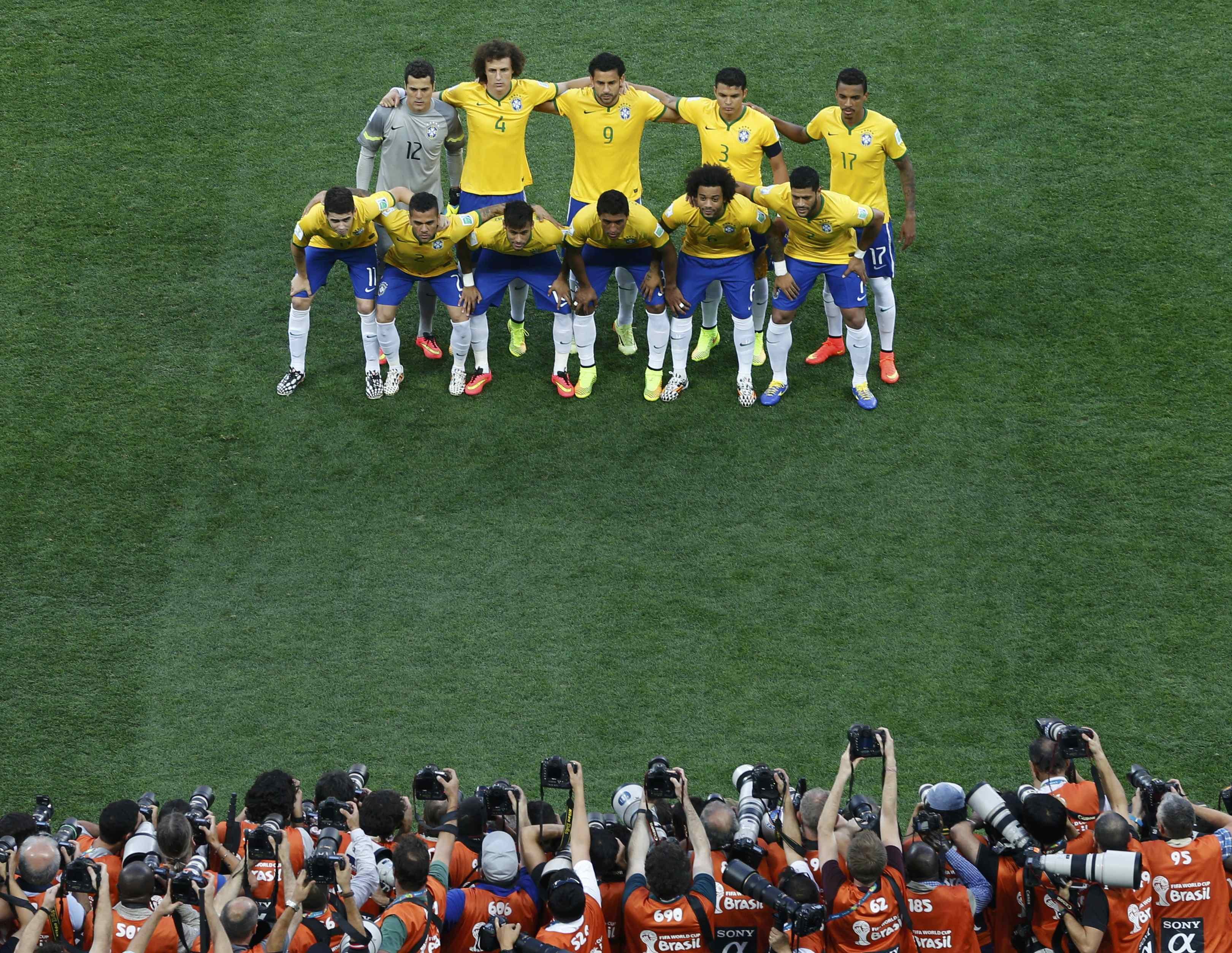 Brazil's national soccer players pose for a team photo before their 2014 World Cup opening match against Croatia at the Corinthians arena in Sao Paulo