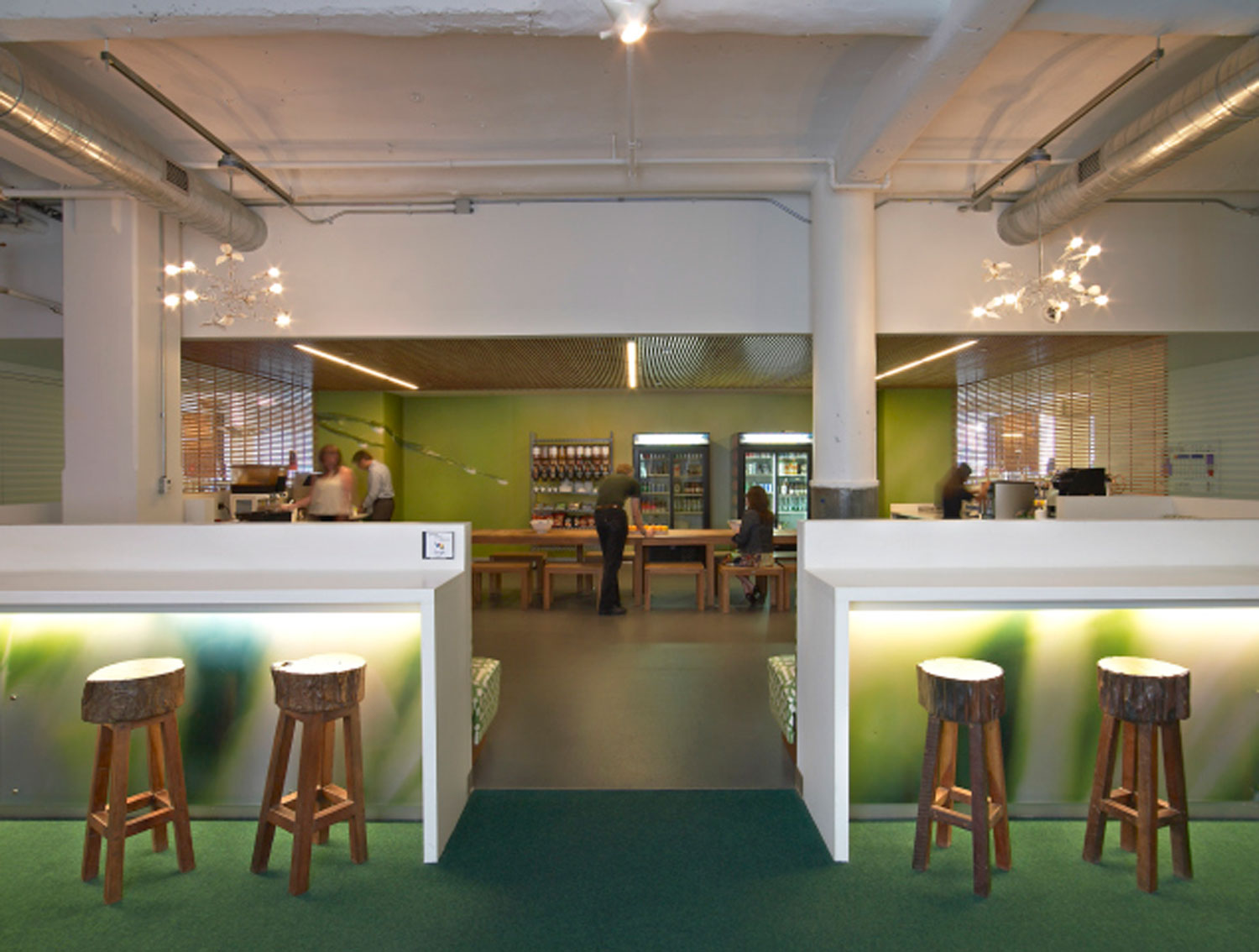 A green themed micro kitchen emphasizes Google's commitment to sustainability.