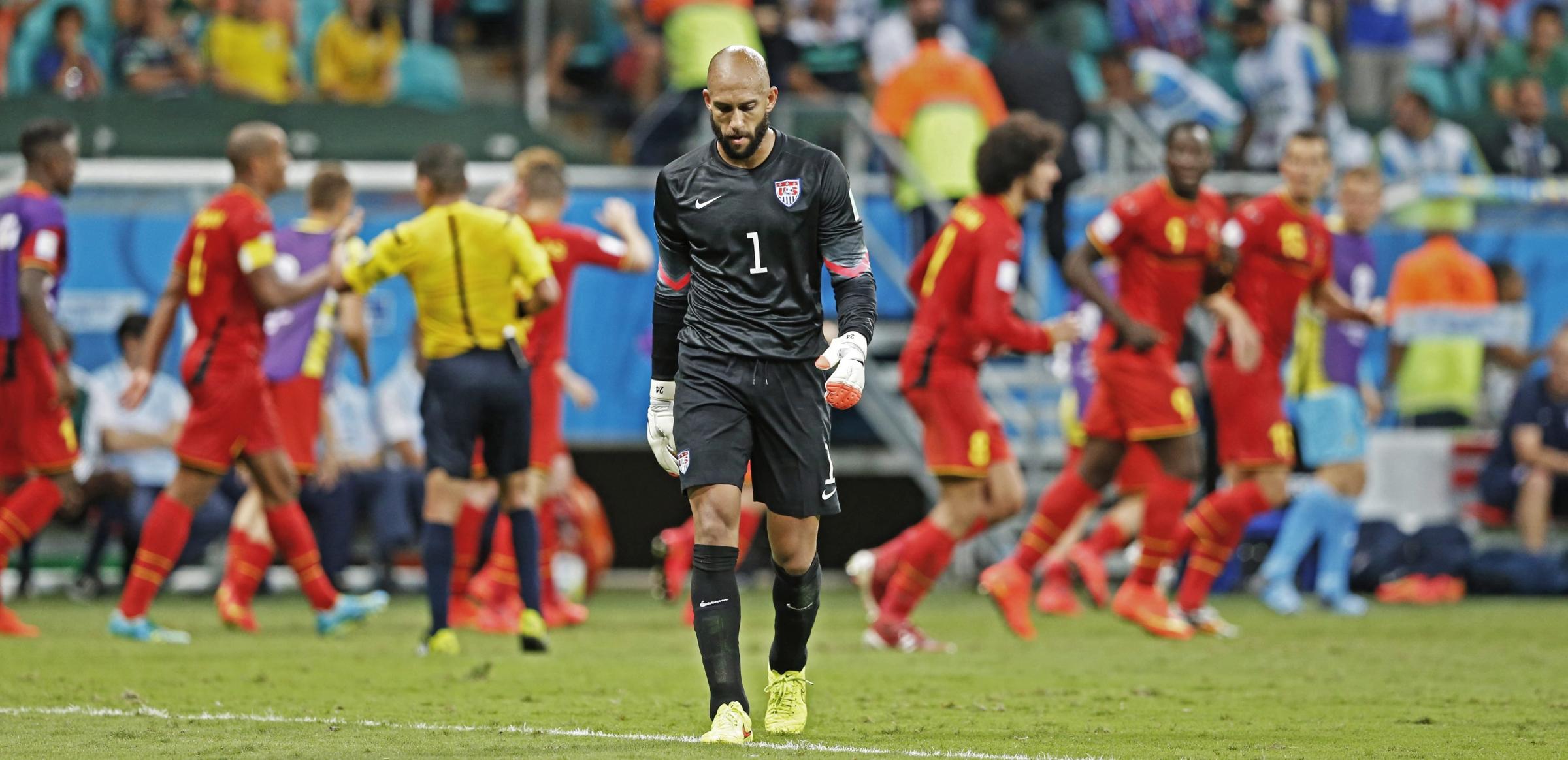 USA's goalkeeper Tim Howard reacts as Belgium's players celebrate their goal during the FIFA World Cup 2014 round of 16 match between Belgium and the USA at the Arena Fonte Nova in Salvador, Brazil on July 1, 2014.