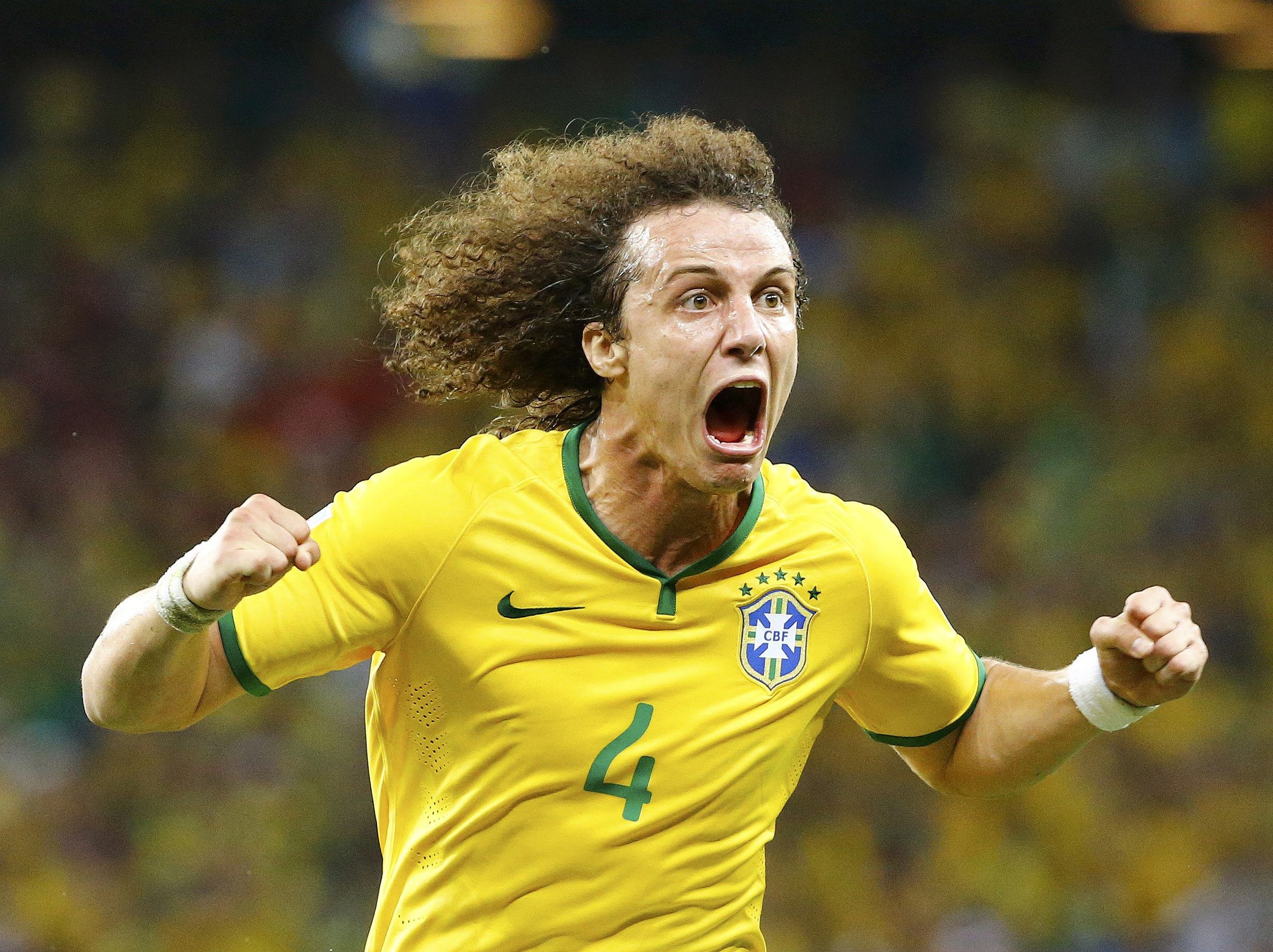 Brazil's David Luiz celebrates after scoring a goal against Colombia during the match at the Castelao arena in Fortaleza, Brazil on July 4, 2014.