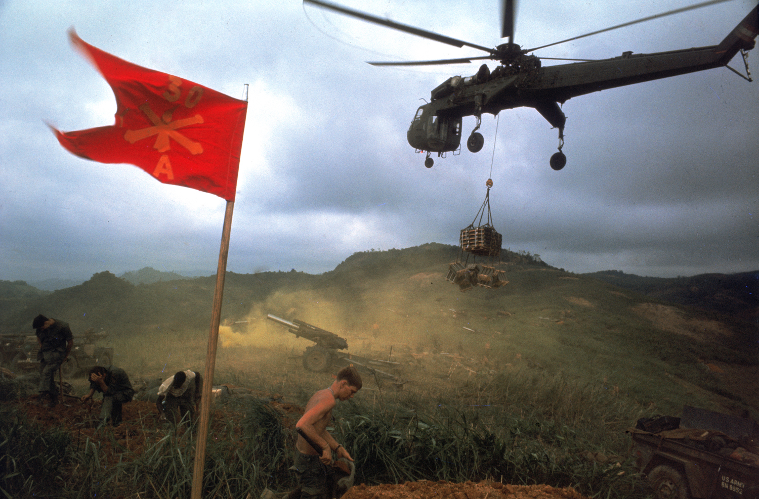 An American 1st Air Cavalry helicopter airlifts supplies into a Marine outpost during Operation Pegasus, Vietnam, spring 1968.