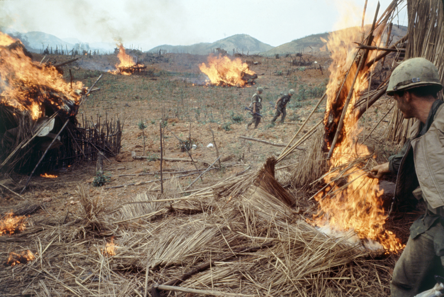American troops burning Vietnamese huts during Operation Pegasus, 1968.