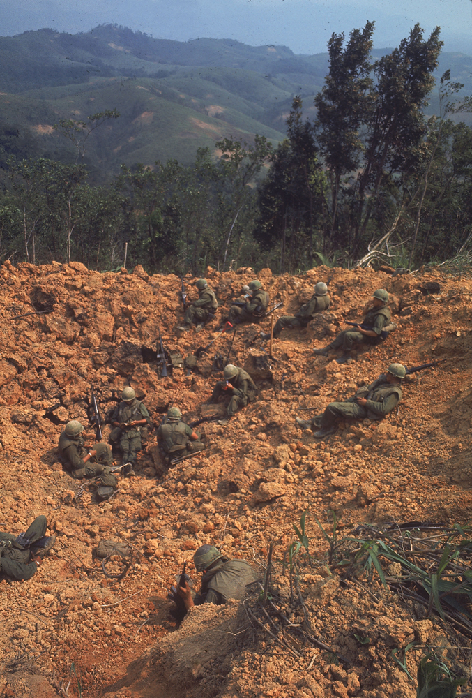 Stranded Marines on bombed-out hillside, awaiting rescue supplies during Operation Pegasus, Vietnam, 1968.