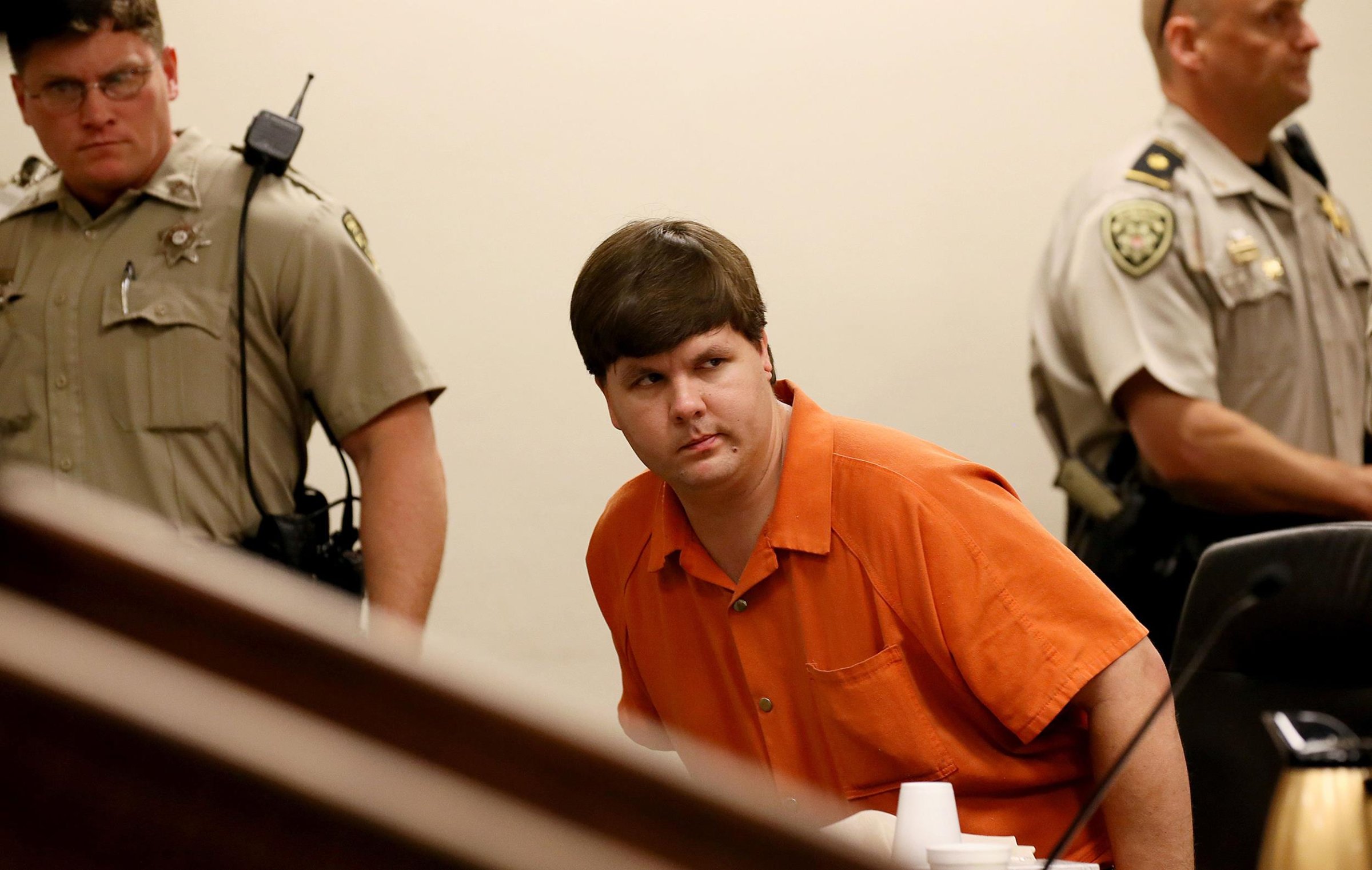 Justin Ross Harris, the father of a toddler who died after police say he was left in a hot car for about seven hours, is escorted out of Cobb County Magistrate Court after he was denied bond, Thursday, July 3, 2014, in Marietta, Ga.