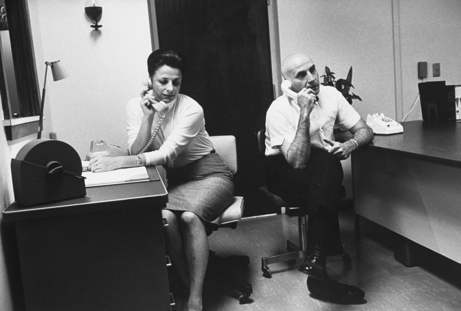 Participating in a radio program, Johnson and Masters answer telephoned questions.