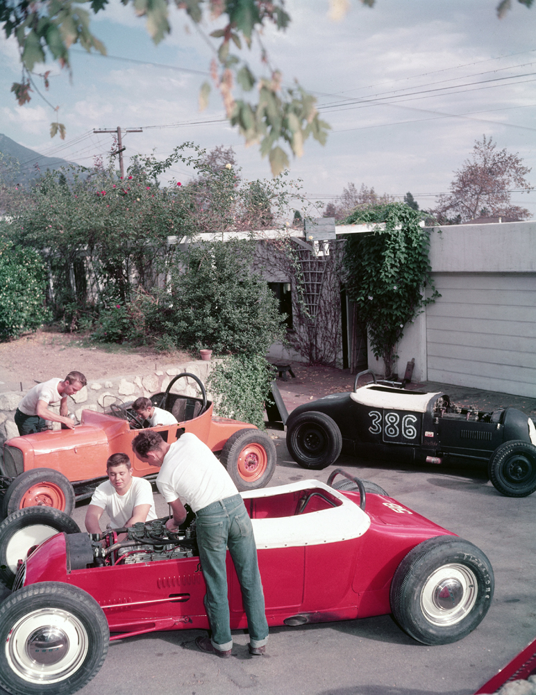 Before a race, Altadena kids tend 'Class B Modified' hot-rods. Unlike some, they are expert mechanics, race on safe tracks, not on the highways.
