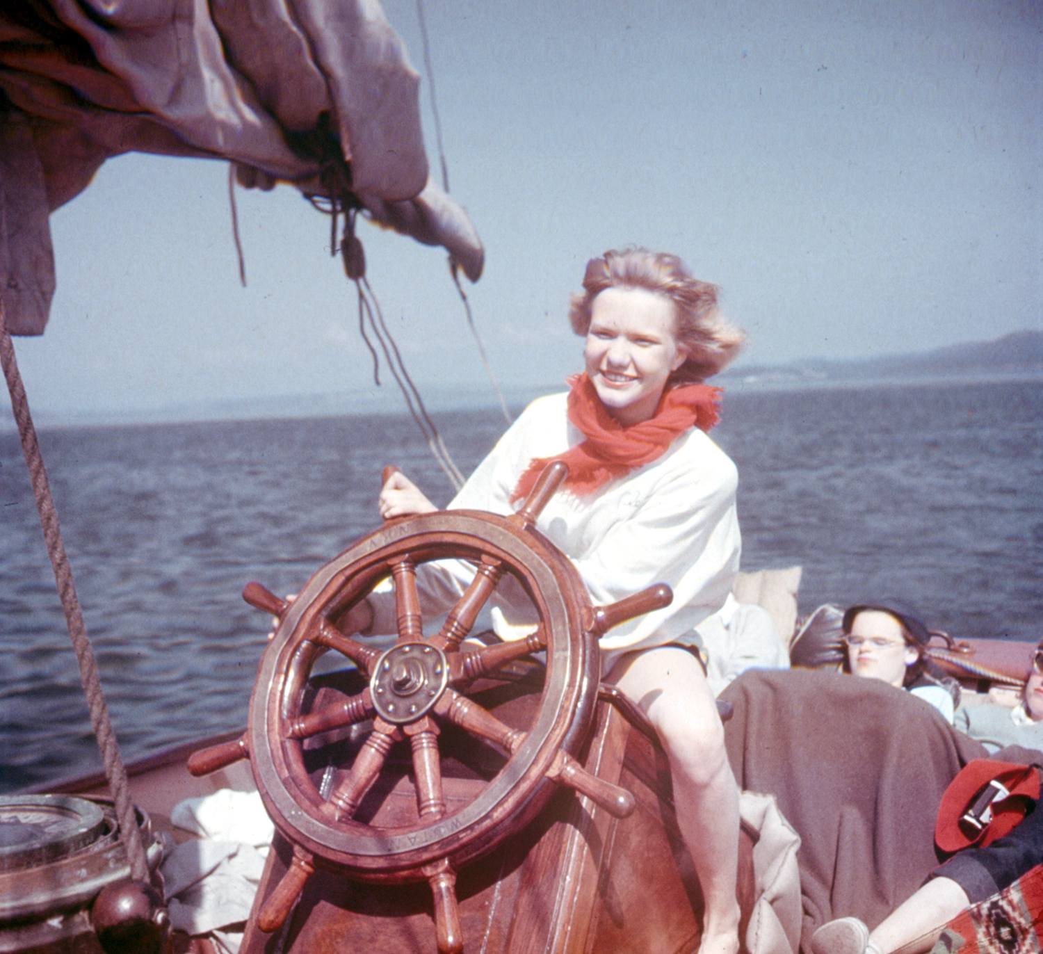 Arlene Nelson, 15, confidently takes wheel of the Night Witch in San Juan Islands.