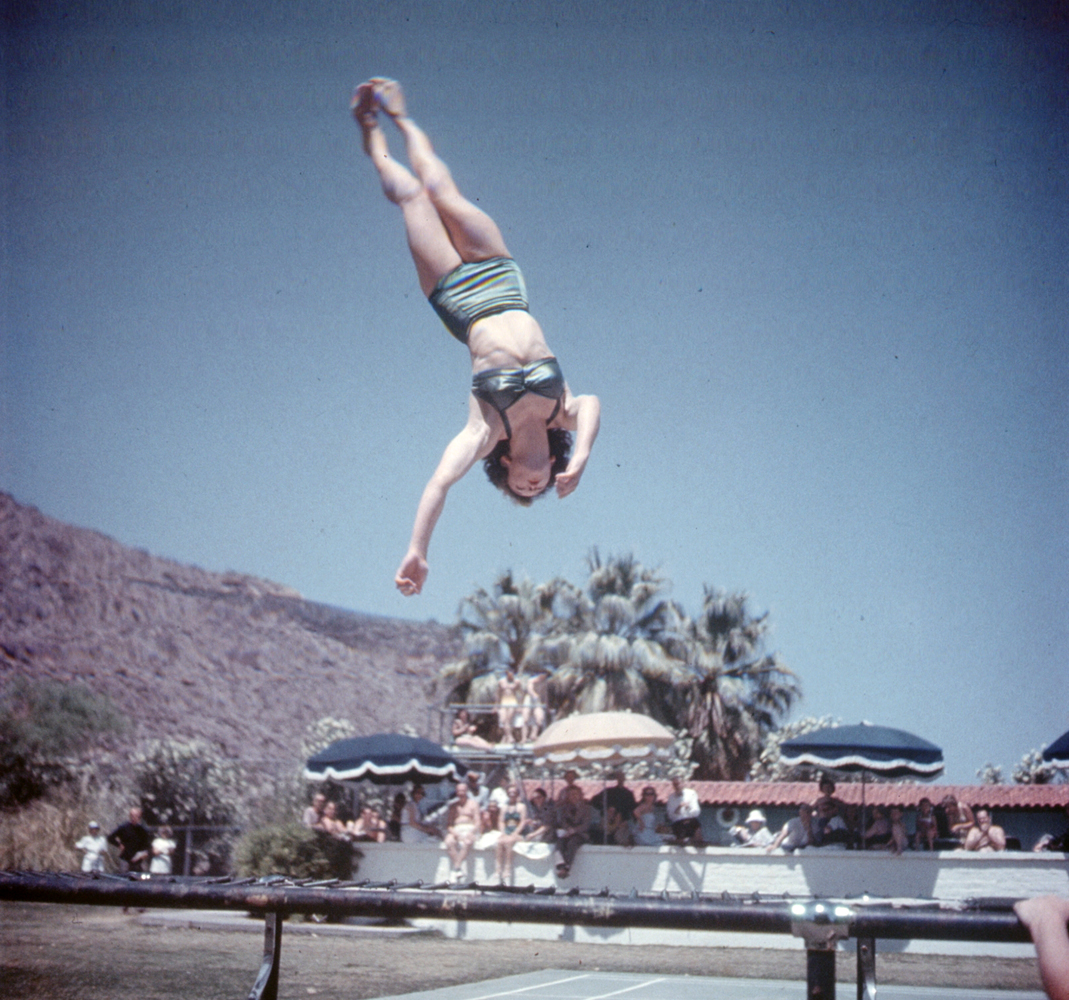 A bouncy trampoline at The Desert Inn, Palm Springs, tosses Dolores Dick of Los Angeles high in the air as she develops muscles and timing for diving.