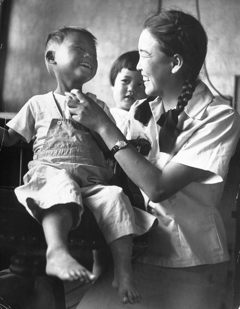 Kang Koo Ri's first smile in a Korean orphanage, 1951.