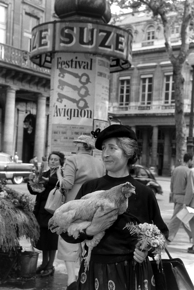 A woman named Marguerite with her chicken, Paris, 1956.