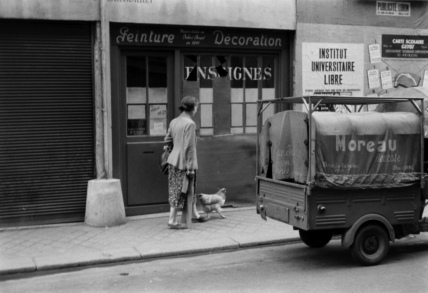 A woman named Marguerite walks a chicken in Paris, 1956.