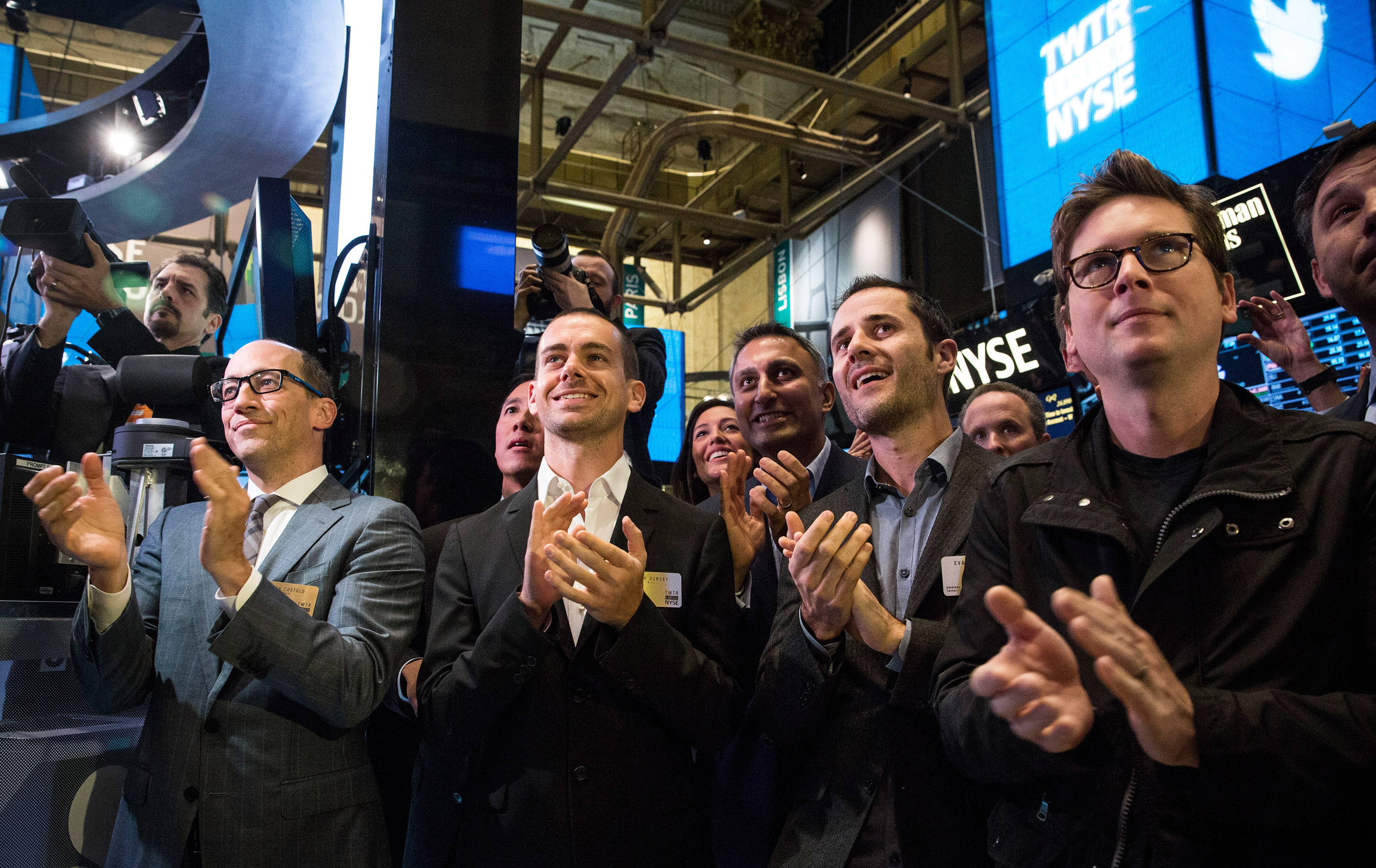 (L-R) Twitter CEO Dick Costolo, Twitter co-founder Jack Dorsey, Twitter co-founder Evan Williams and Twitter co-founder Biz Stone applaud as Twitter rings the opening bell at the New York Stock Exchange (NYSE) while also celebrating the company's IPO on November 7, 2013 in New York City. (Andrew Burton—Getty Images)
