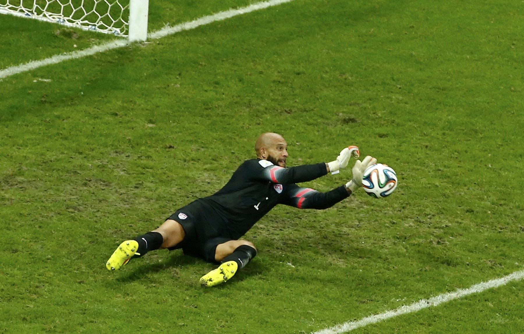 Goalkeeper Tim Howard of the U.S. saves a shot during their 2014 World Cup round of 16 game against Belgium at the Fonte Nova arena in Salvador, Brazil on July 1, 2014.