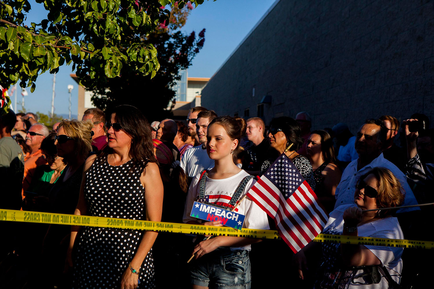 Residents and protestors attend a town hall meeting to discuss the processing of undocumented immigrants in Murrieta, California