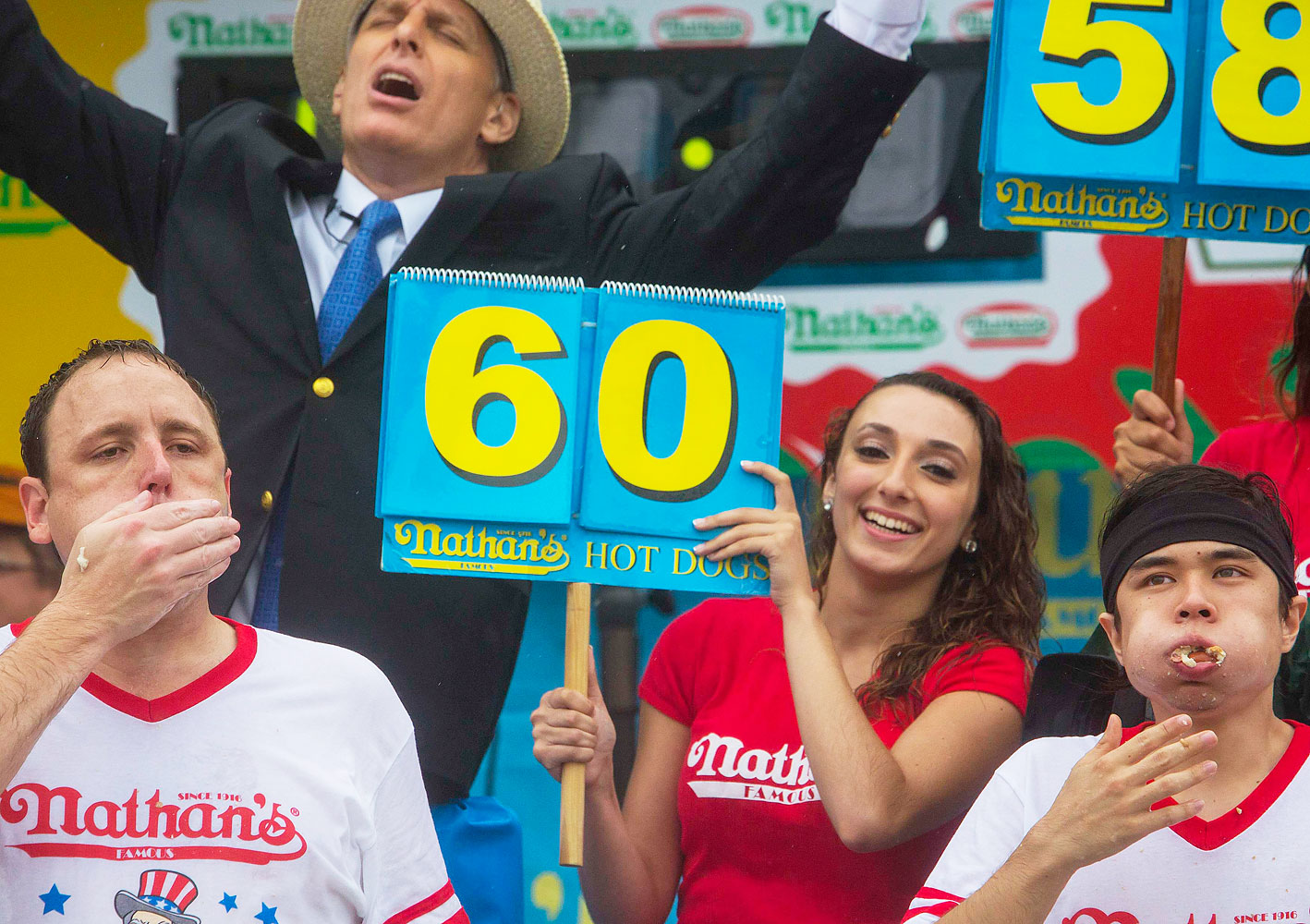 Joey Chestnut, left, and Matt Stonie, right, at the final moments of the annual Nathan's Famous Fourth of July International Hot Dog-Eating Contest at Coney Island.
