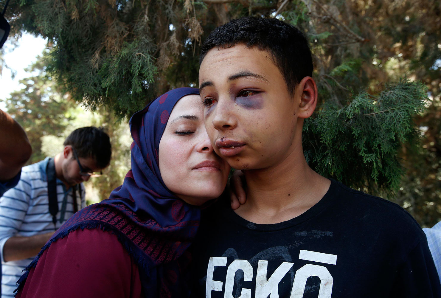 Tariq Khdeir, right, is greeted by his mother after being released from jail in Jerusalem July 6, 2014. (Ronen Zvulun—Reuters)
