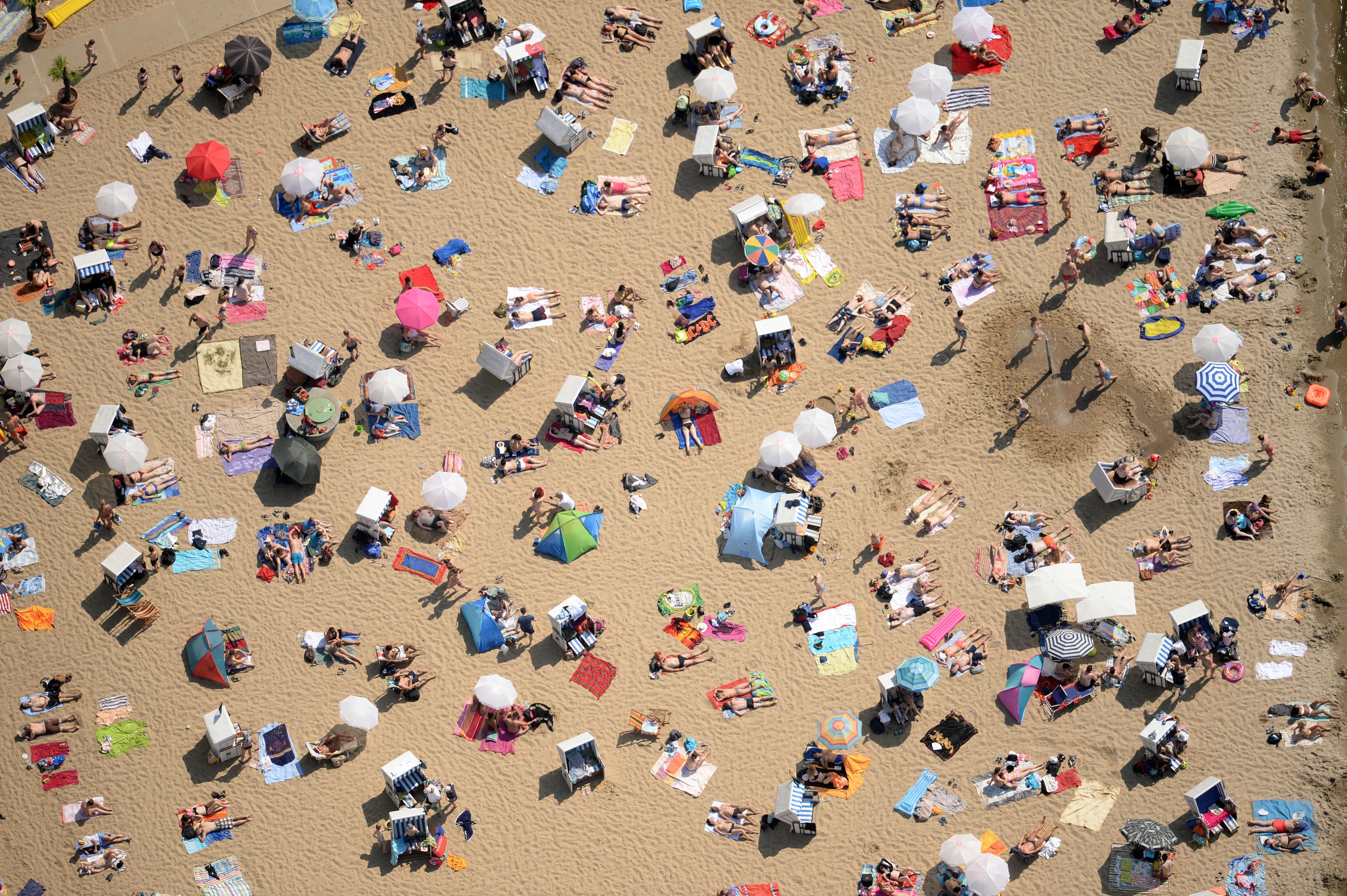 An aerial view shows people crowding the beach of the lake Wannsee in Berlin, eastern Germany, on June 8, 2014. (Ralf Hirschberger—AFP/Getty Images)