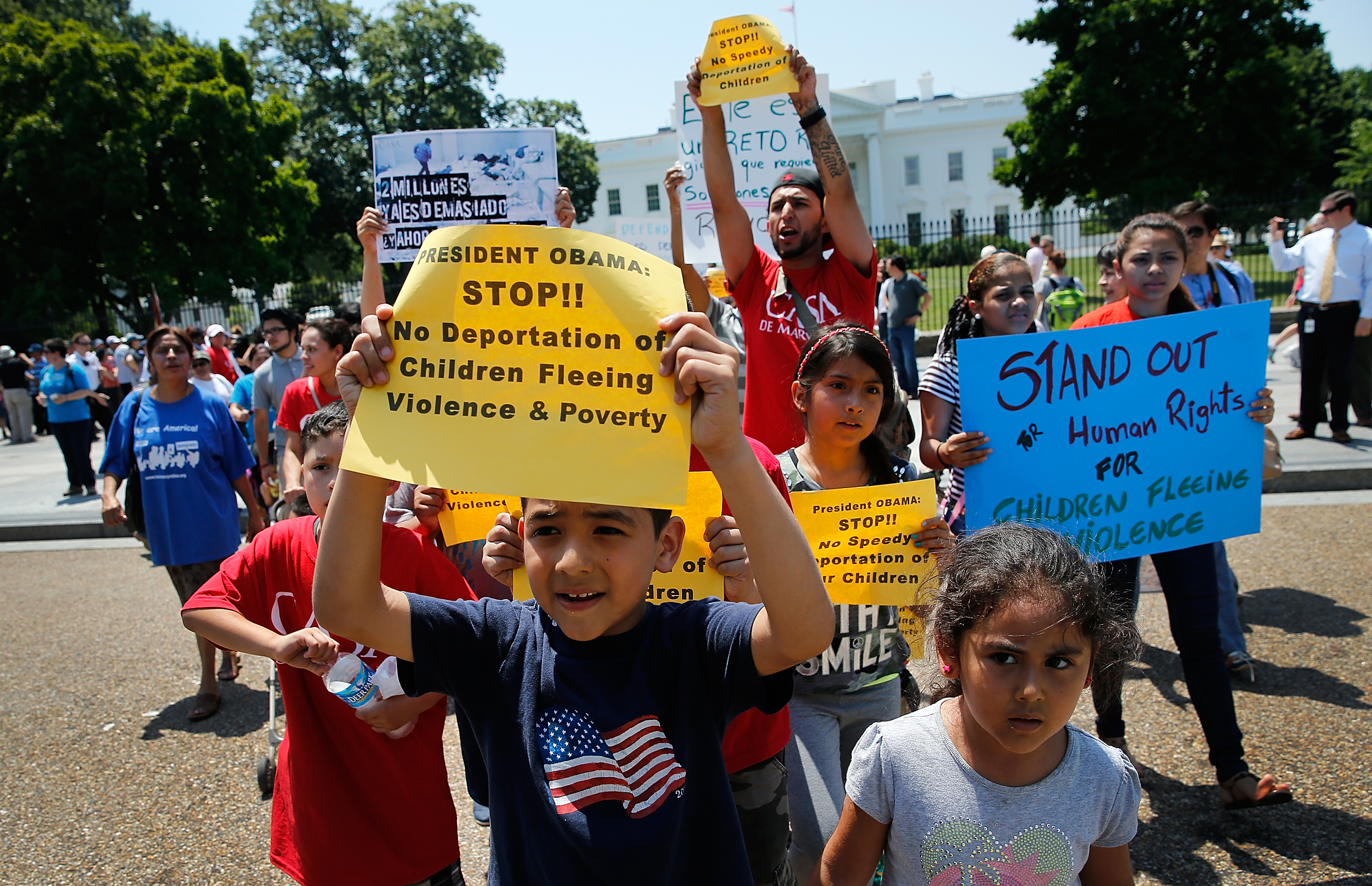 Young children join immigration reform protesters while marching in front of the White House July 7, 2014 in Washington, DC. (Win McNamee—Getty Images)